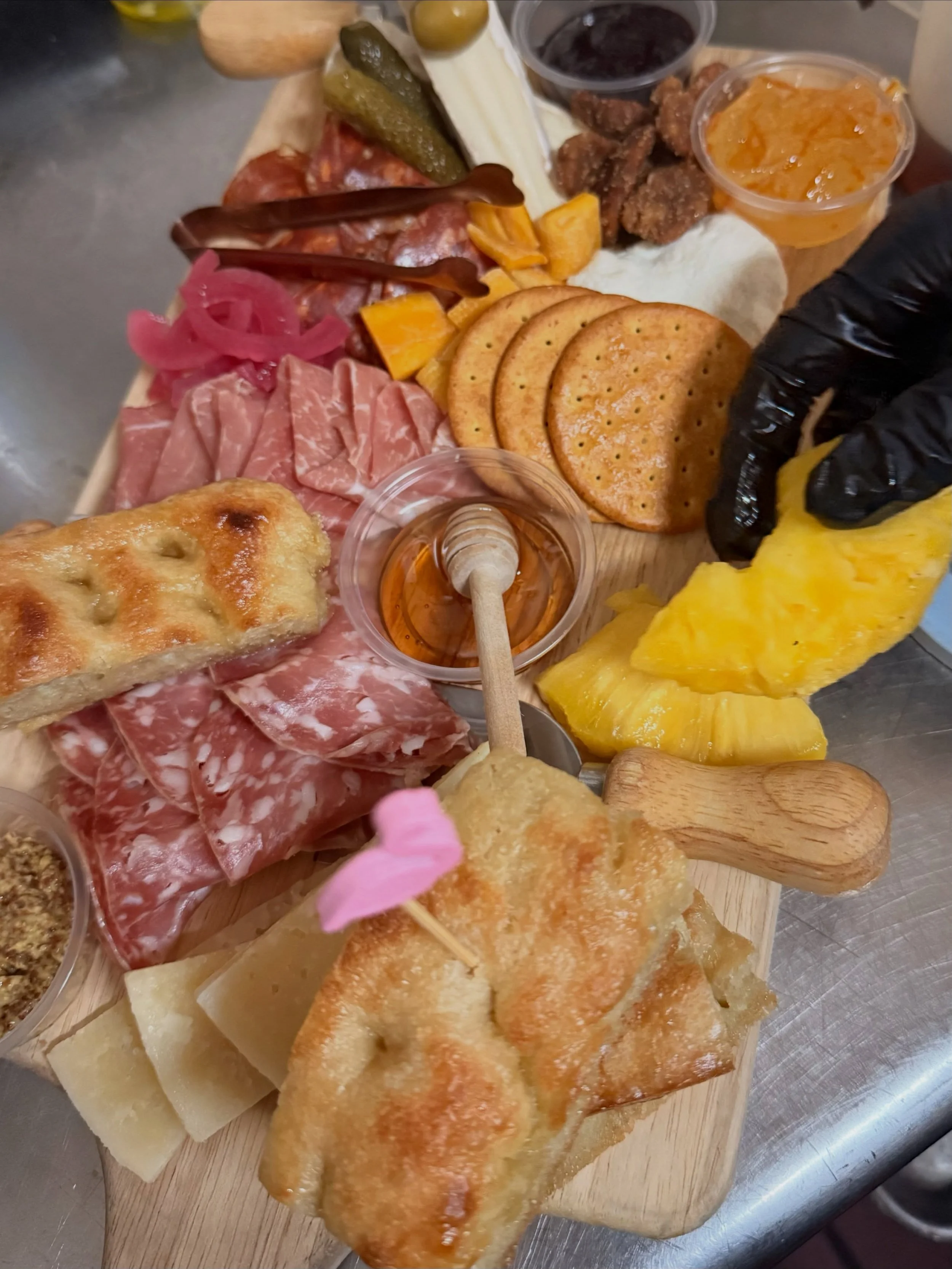 Hand sliced meat, fresh fruit, homemade focaccia &amp; lots of heart goes into every charcuterie board at The Wine House &amp; BBQ 💕✨

Pairs perfectly with HALF-OFF BOTTLES every Tuesday this summer! 

🕰️ Today&rsquo;s Hours 4-9
✨Golden Hour 4-6 pm