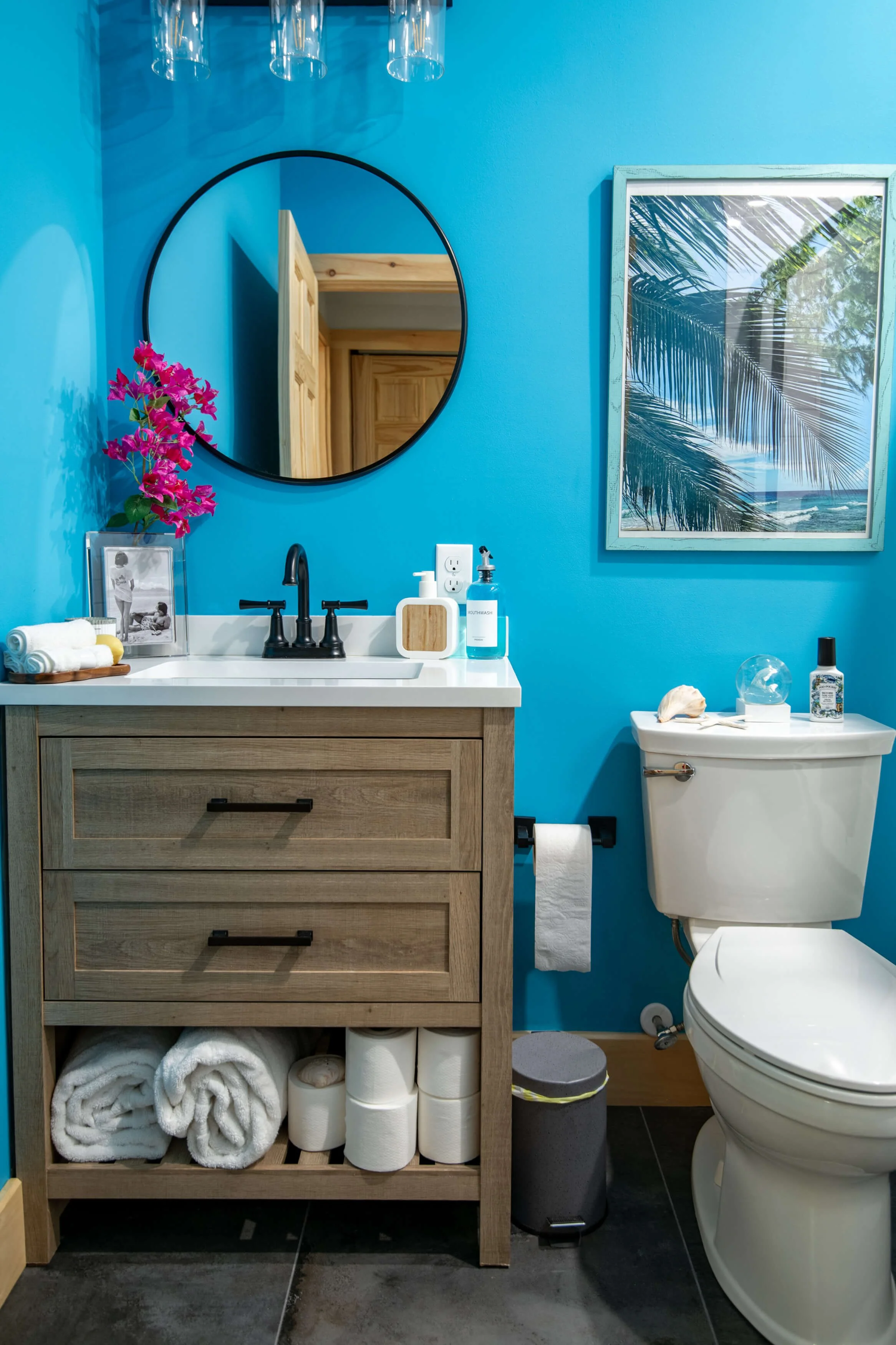 Bright-blue-bathroom-with-marble-wood-sink
