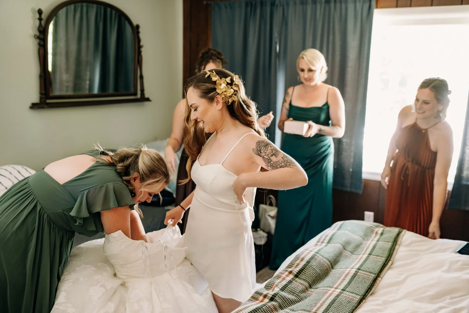 brides-maids-help-bride-with-dress.jpg