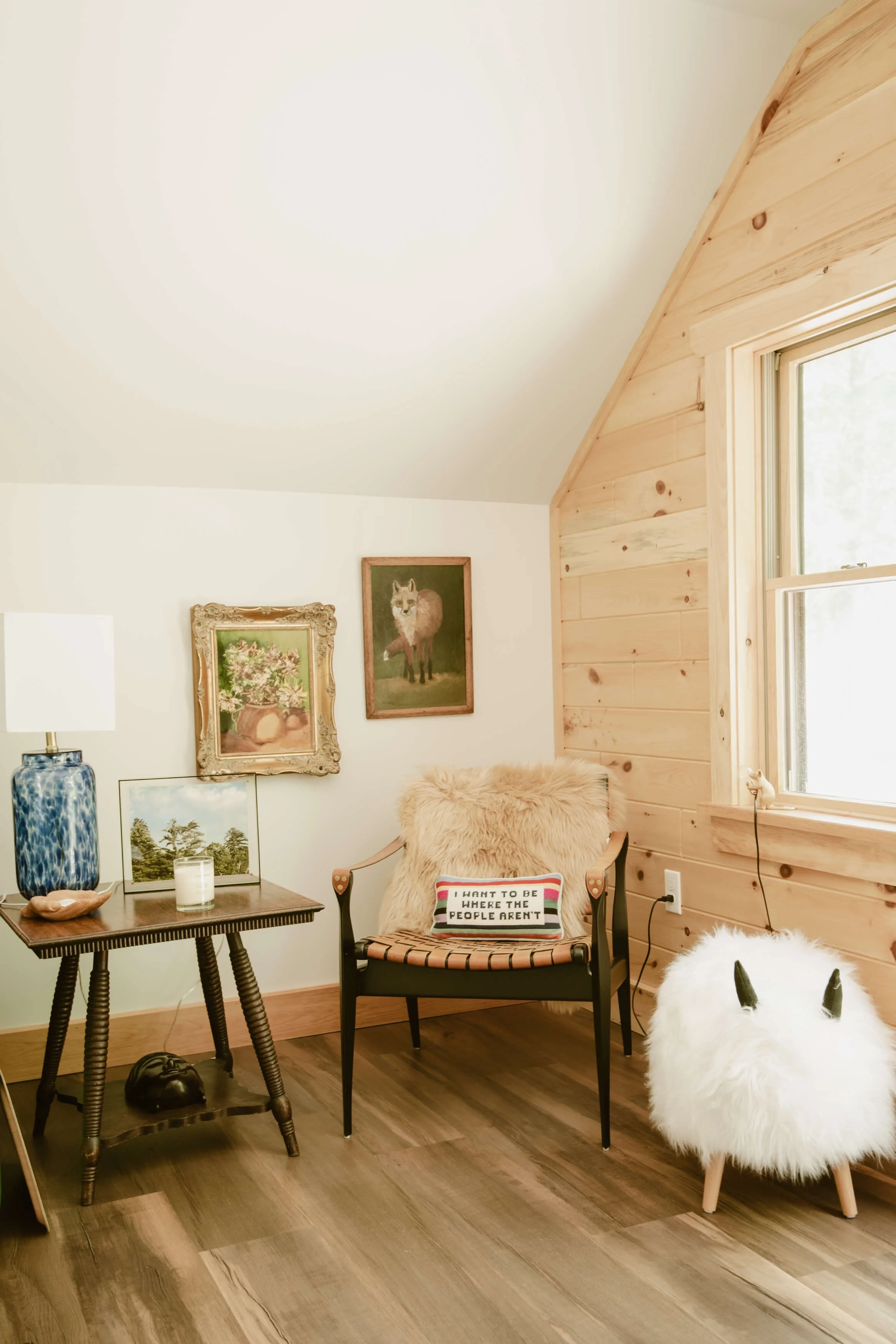 corner chair next to window with end table