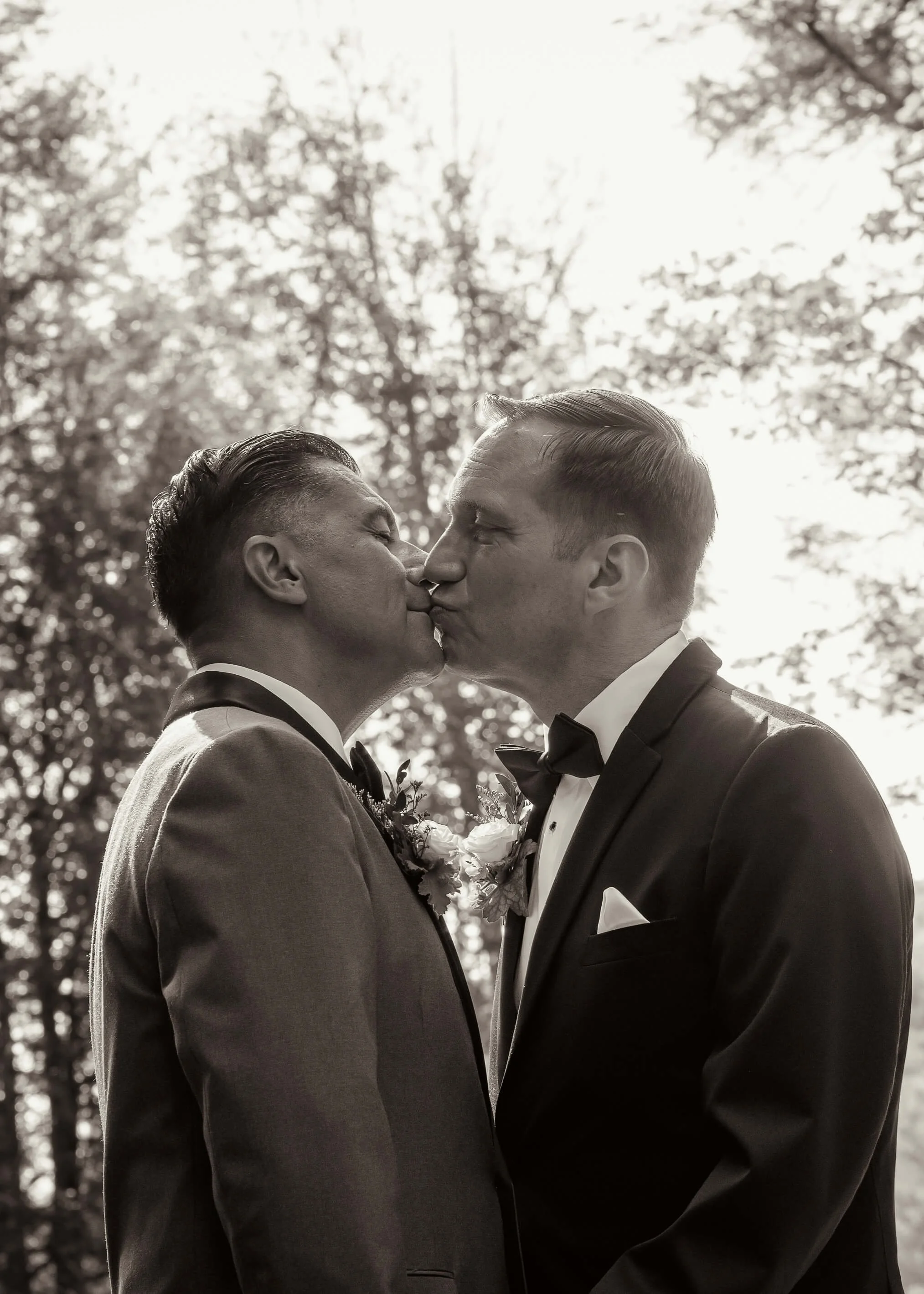 Groom-and-groom-share-a-kiss-before-ceremony
