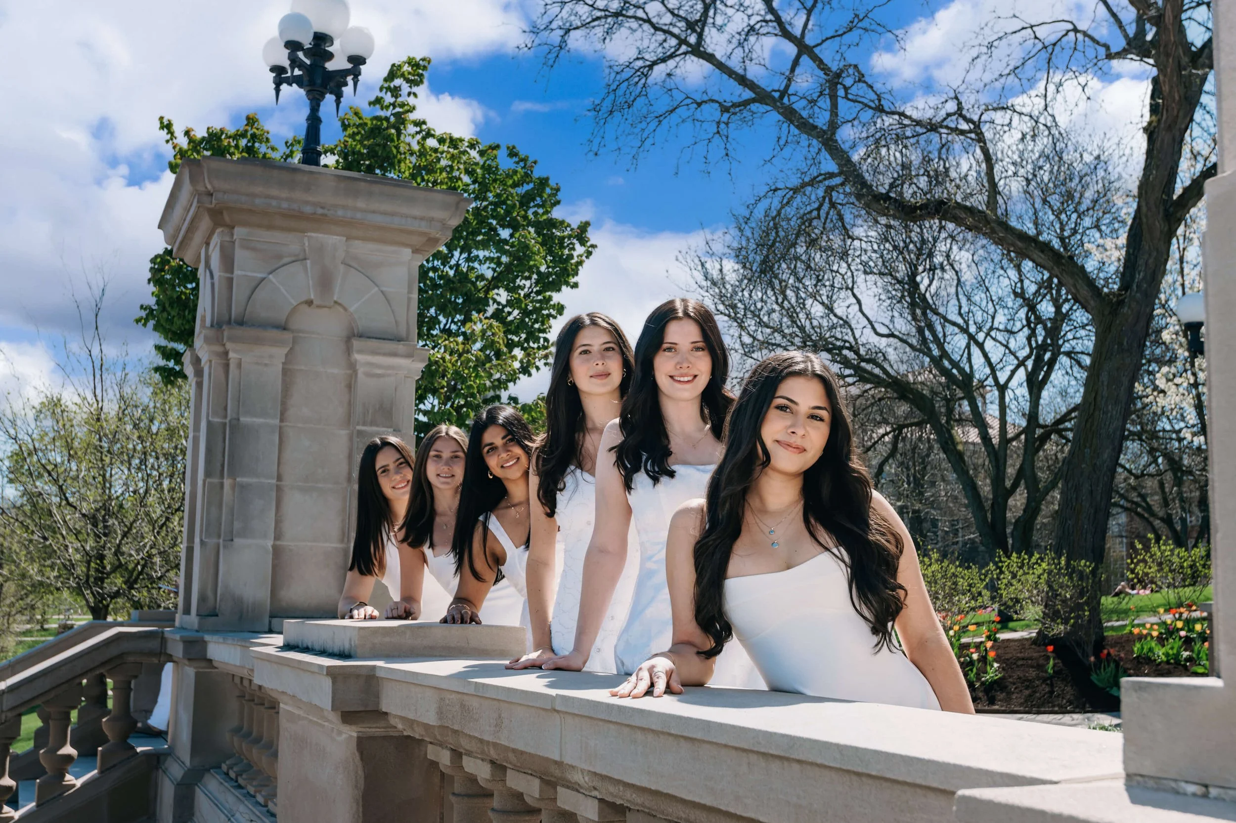 A group of Syracuse University sorority sisters from the Class of 2026 posing for an outdoor photo session by Francine Rambousek