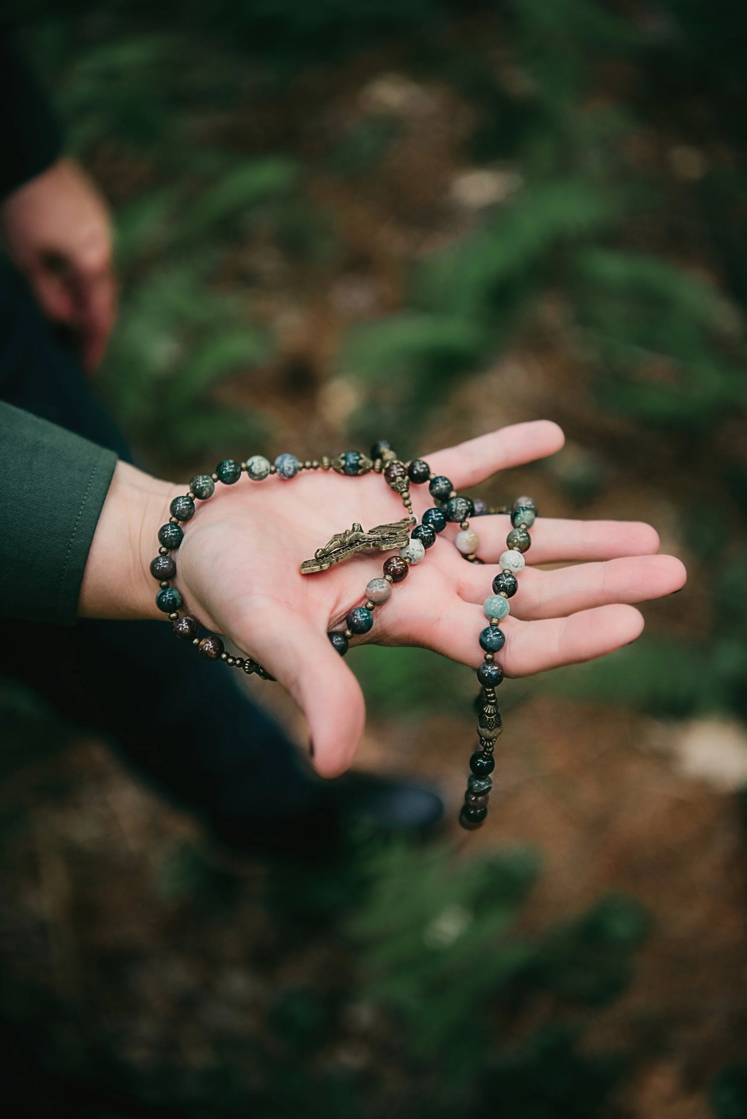Rosary in a hand.