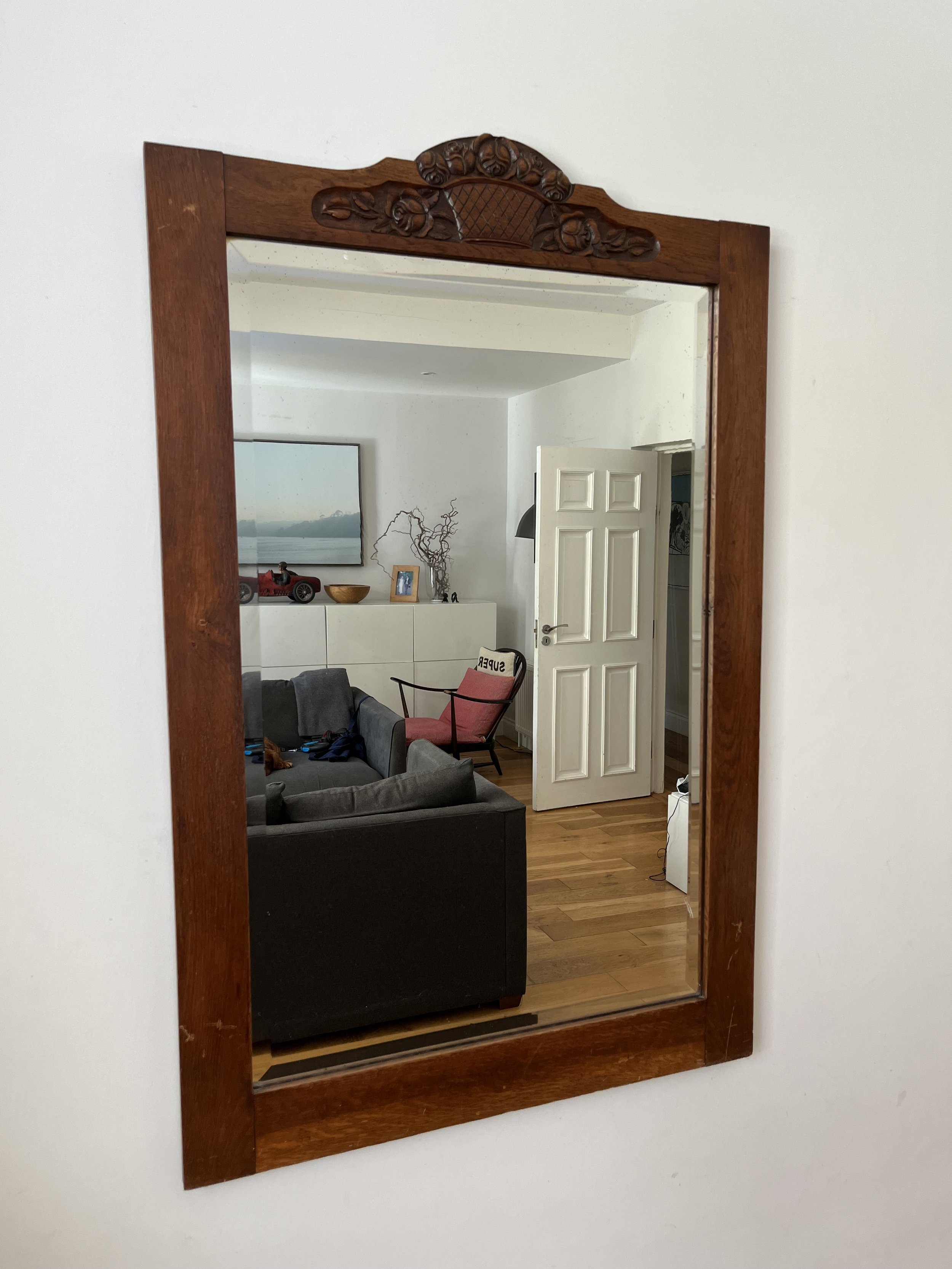 Secondhand vintage large beveled mirror in wooden frame