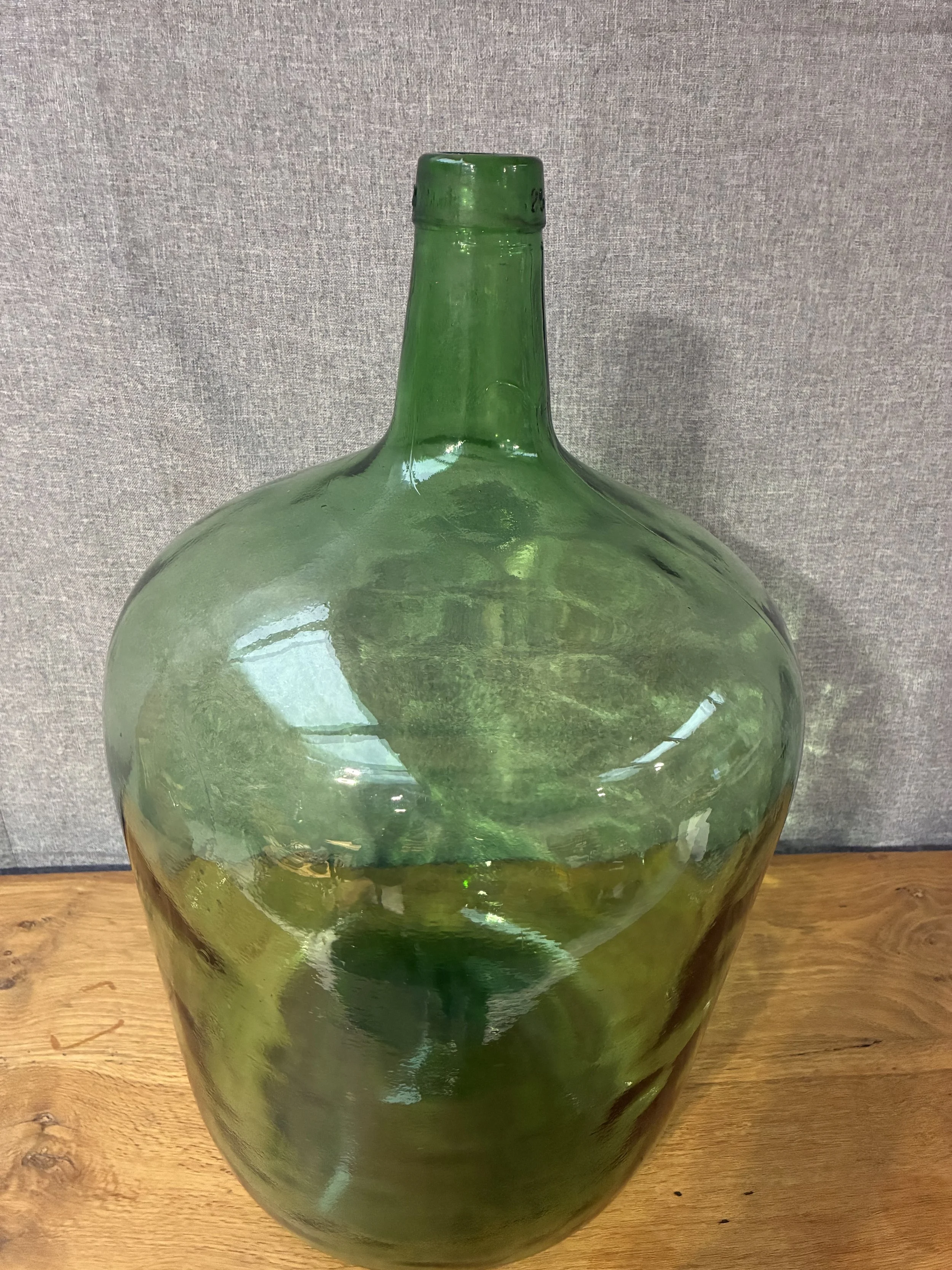 Secondhand vintage glass dame-jeanne carboy