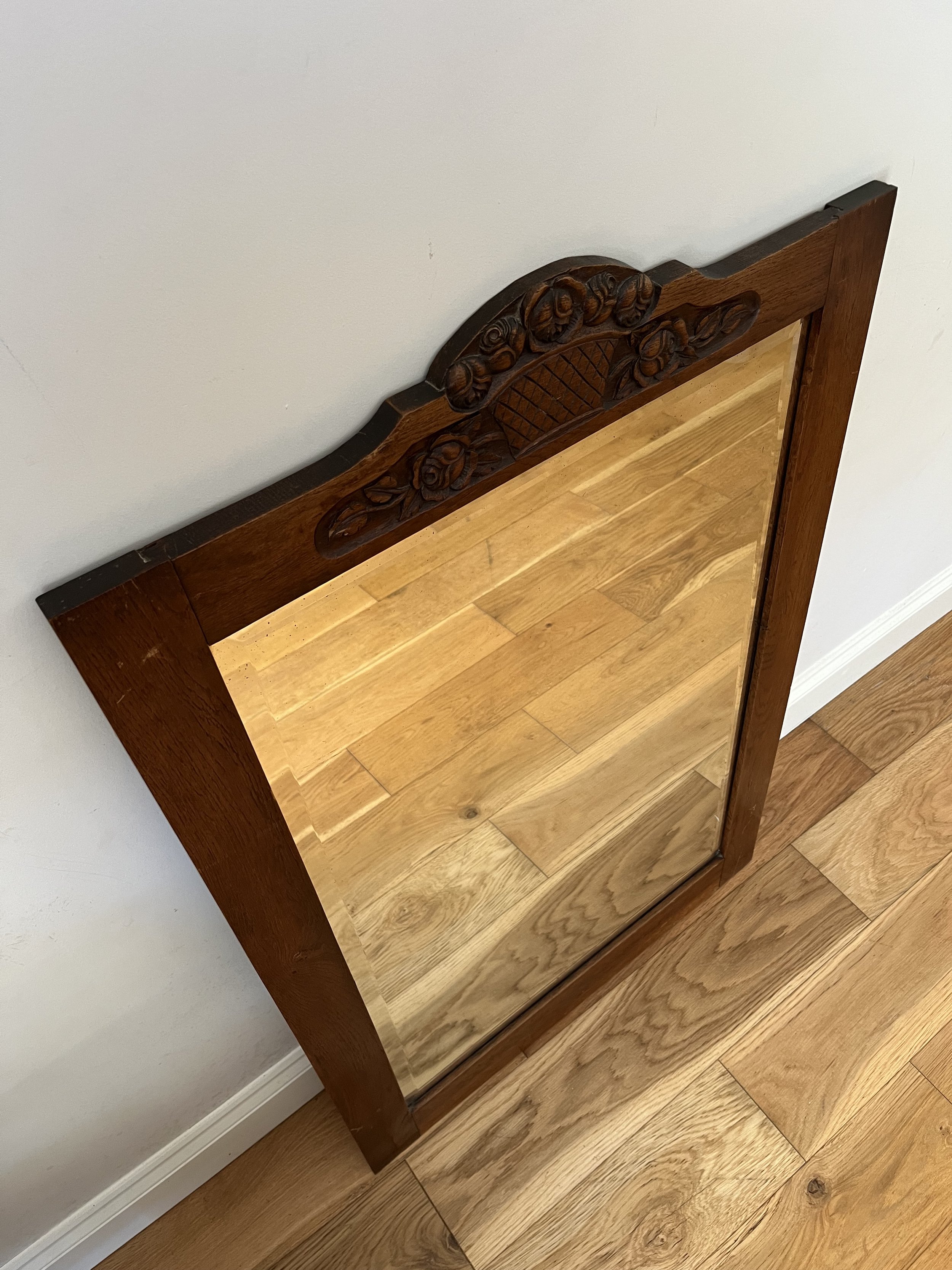 Secondhand vintage large beveled mirror in wooden frame