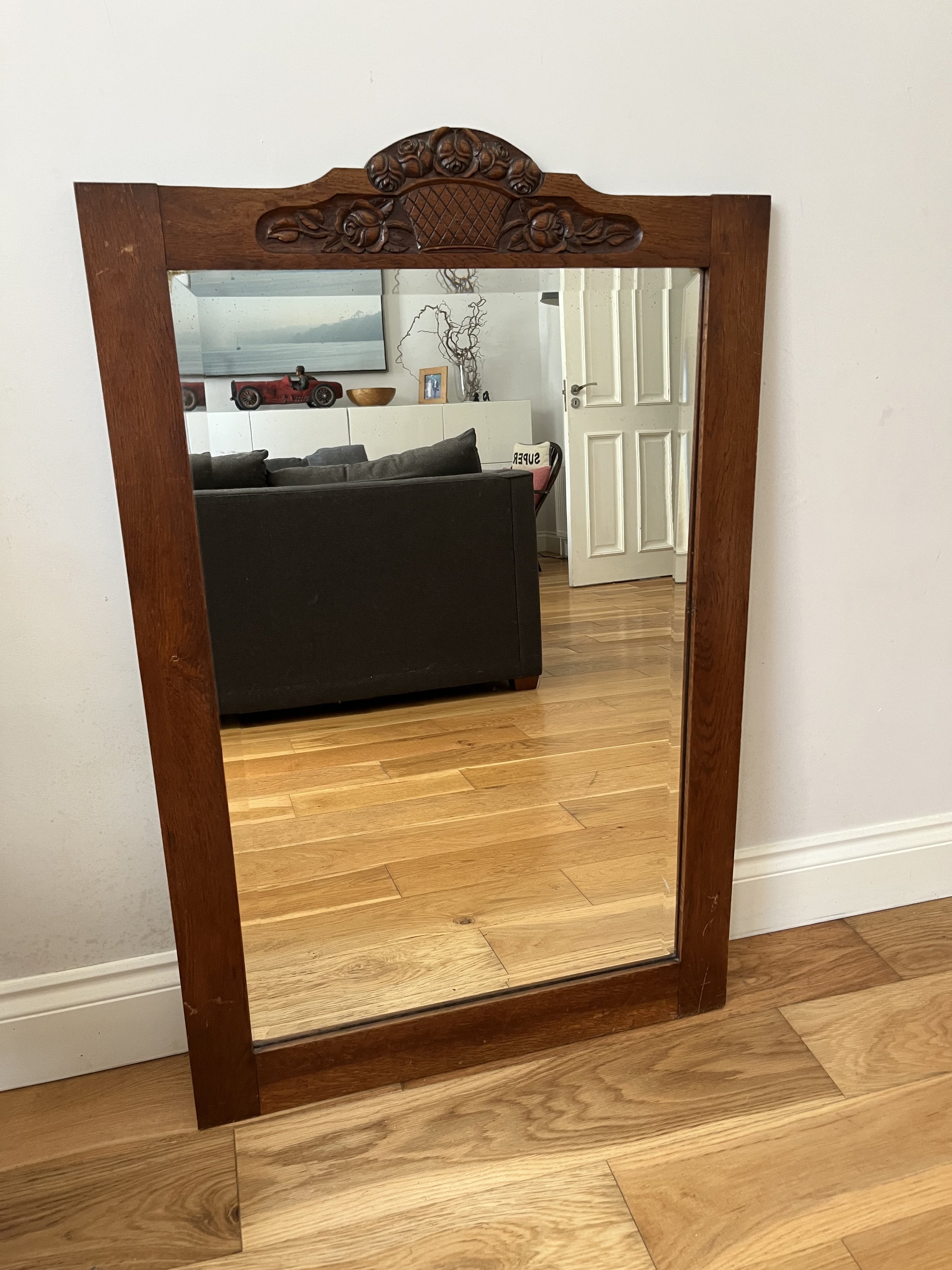 Secondhand vintage large beveled mirror in wooden frame