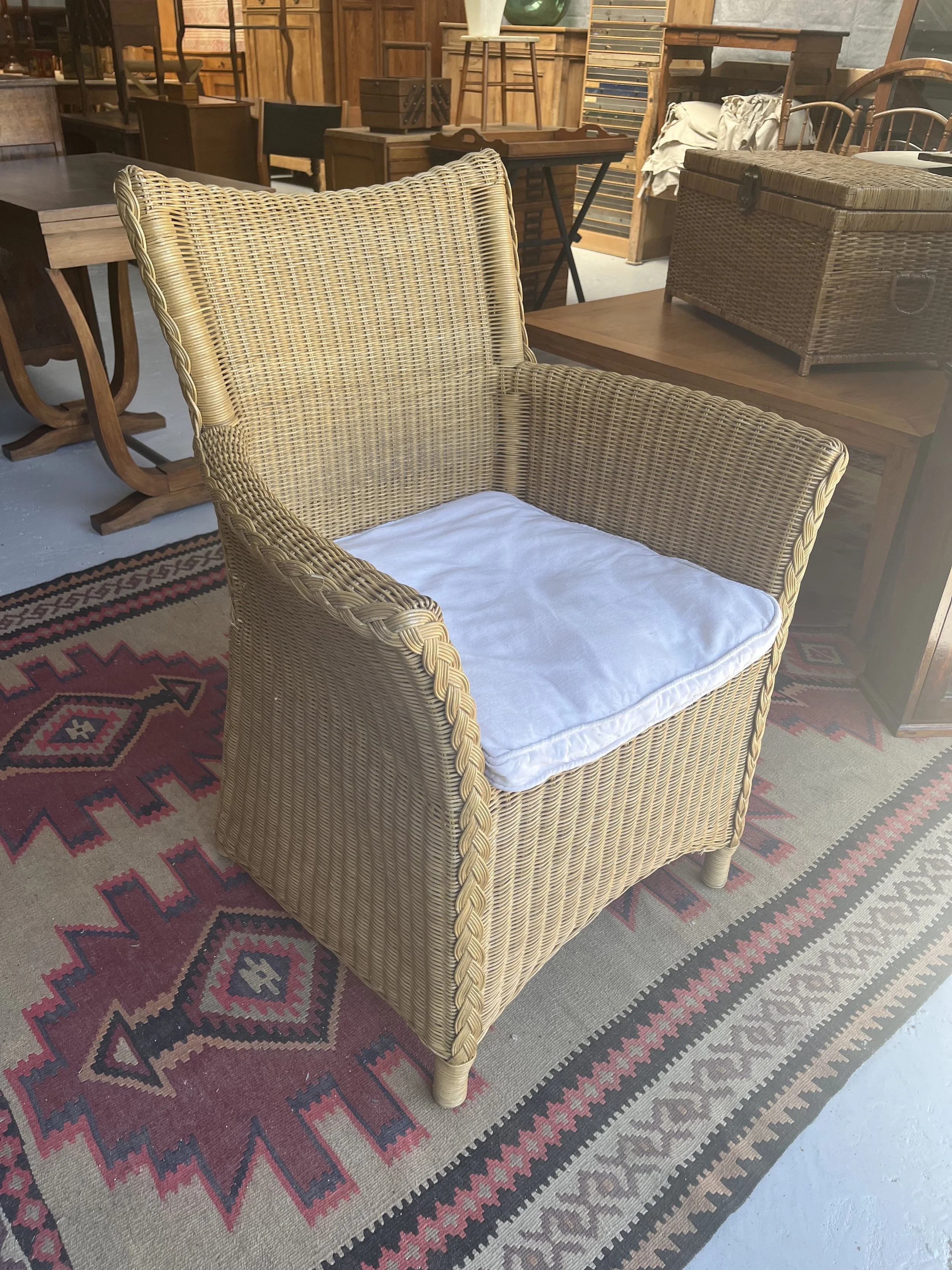 Secondhand vintage wicker armchair