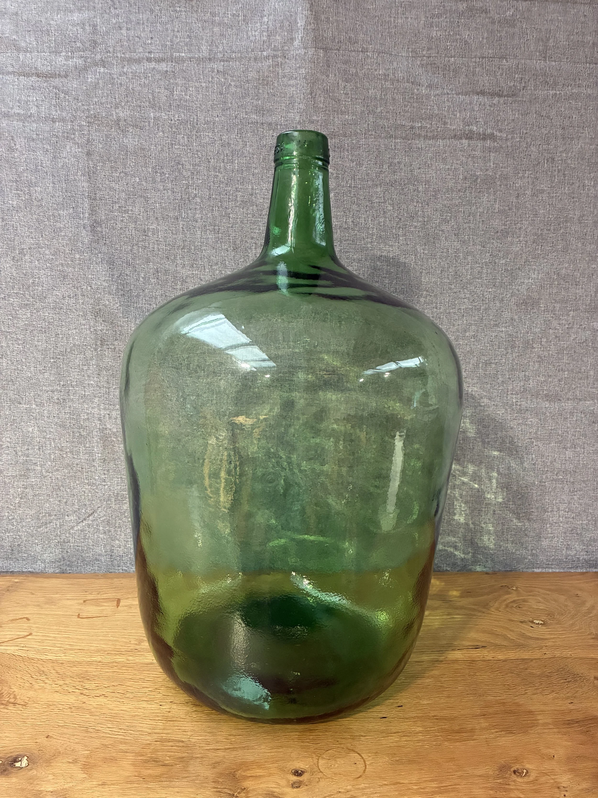 Secondhand vintage glass dame-jeanne carboy
