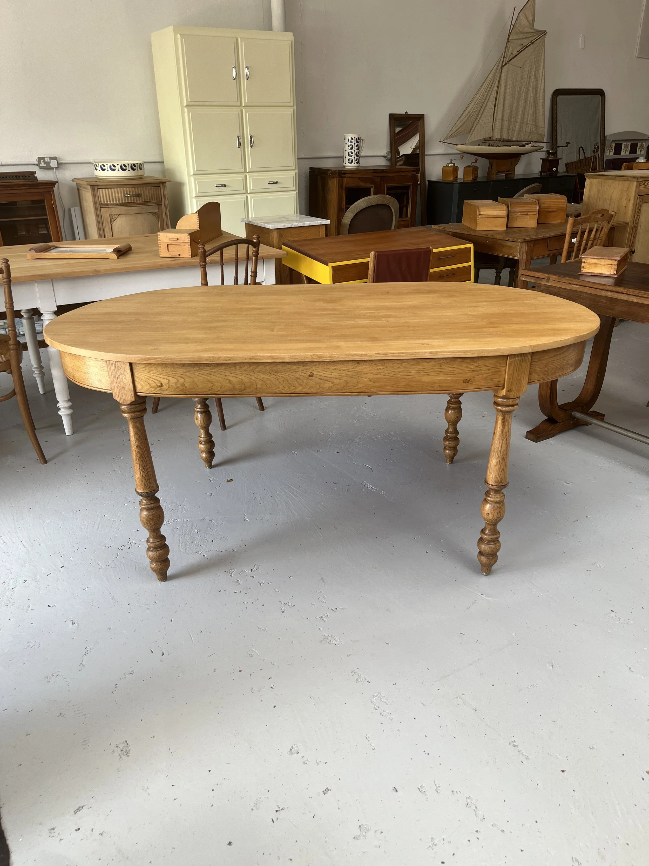 Secondhand vintage oval dining table