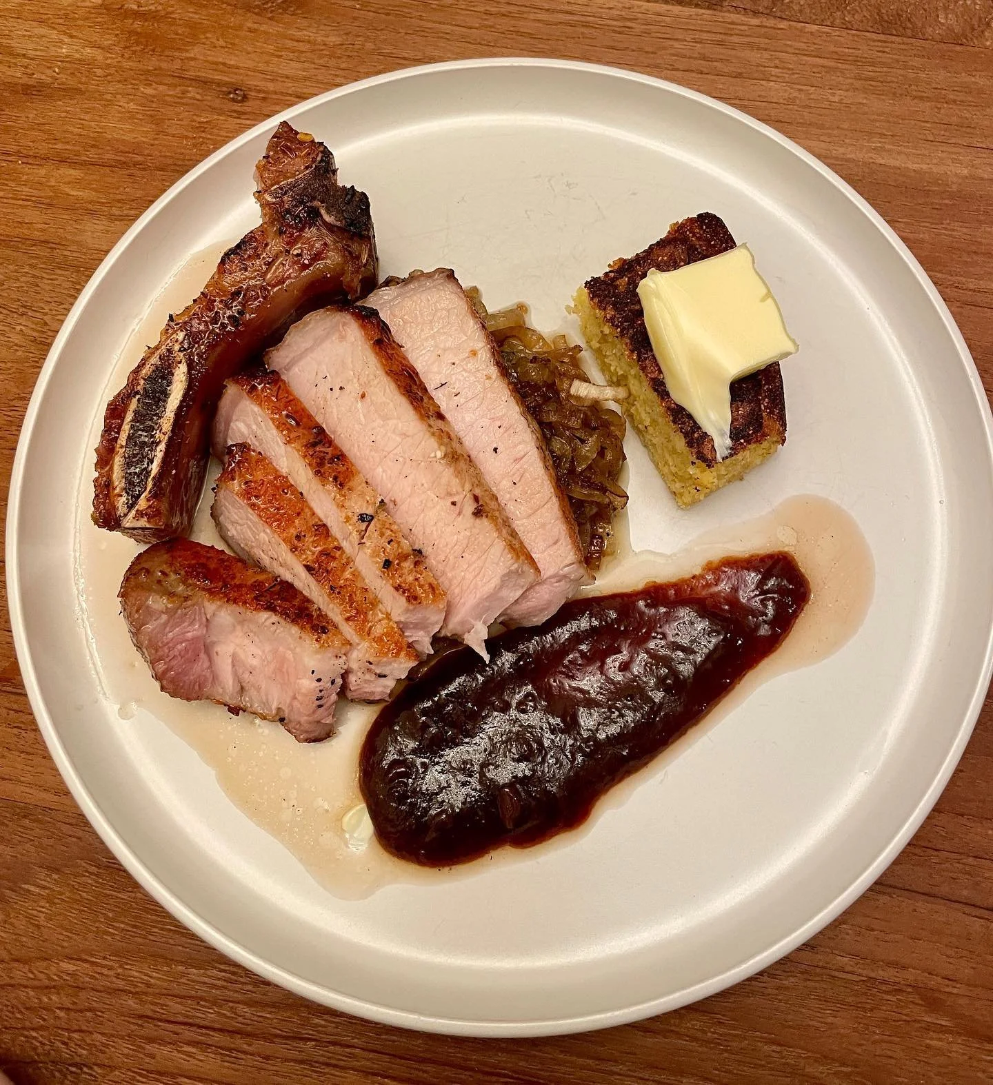 Pan roasted pork chop with medjool date bourbon bbq sauce and @huskrestaurant @ansonmills cornbread.