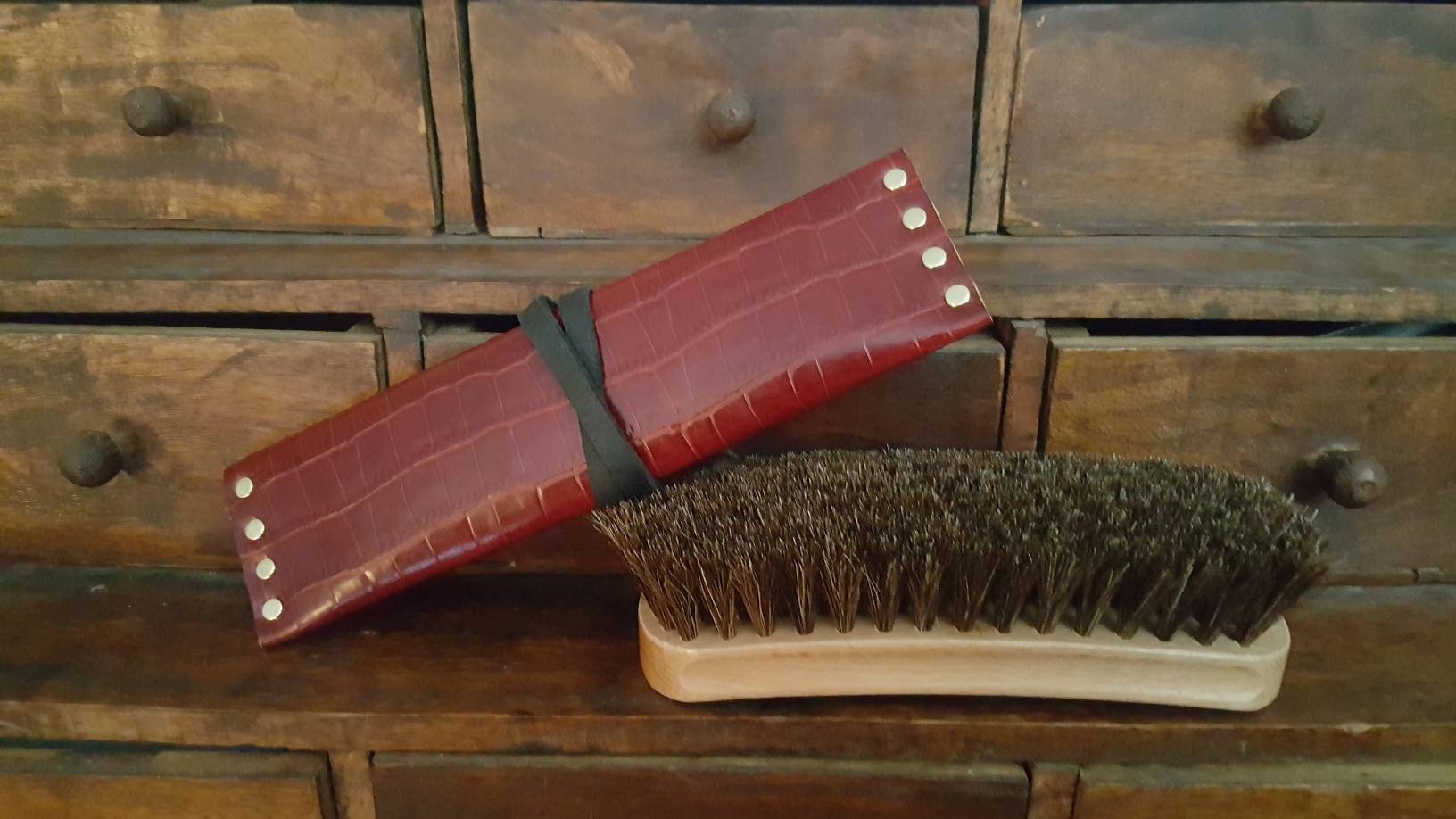 Red and black leather Wartenburg Wheel case