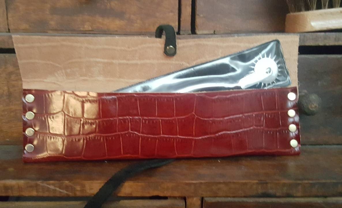 Red and black leather Wartenburg Wheel case