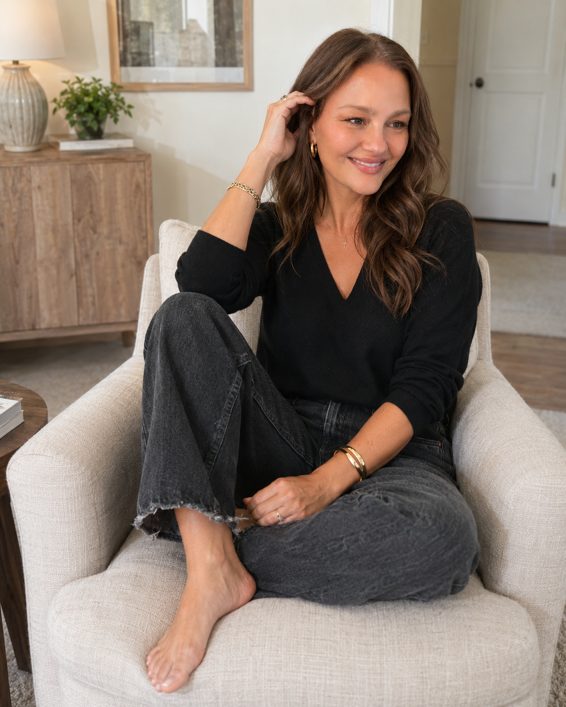 Elizabeth Boyer, MA, LMFT & Yoga Teacher in McKinney Texas sitting in chair in a therapy office.
