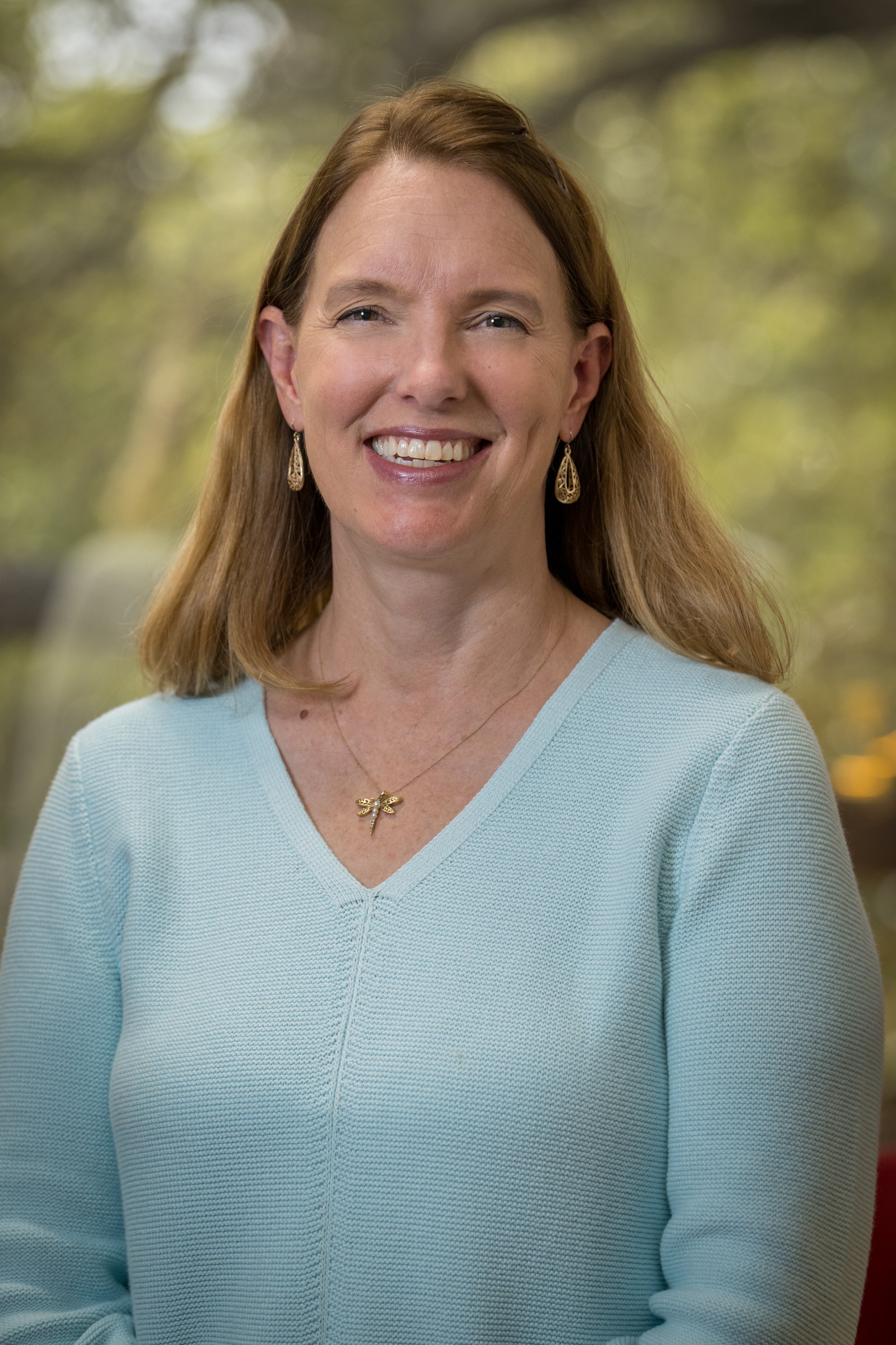 Holly McFarland is a blonde woman. She is a coach for young adults.