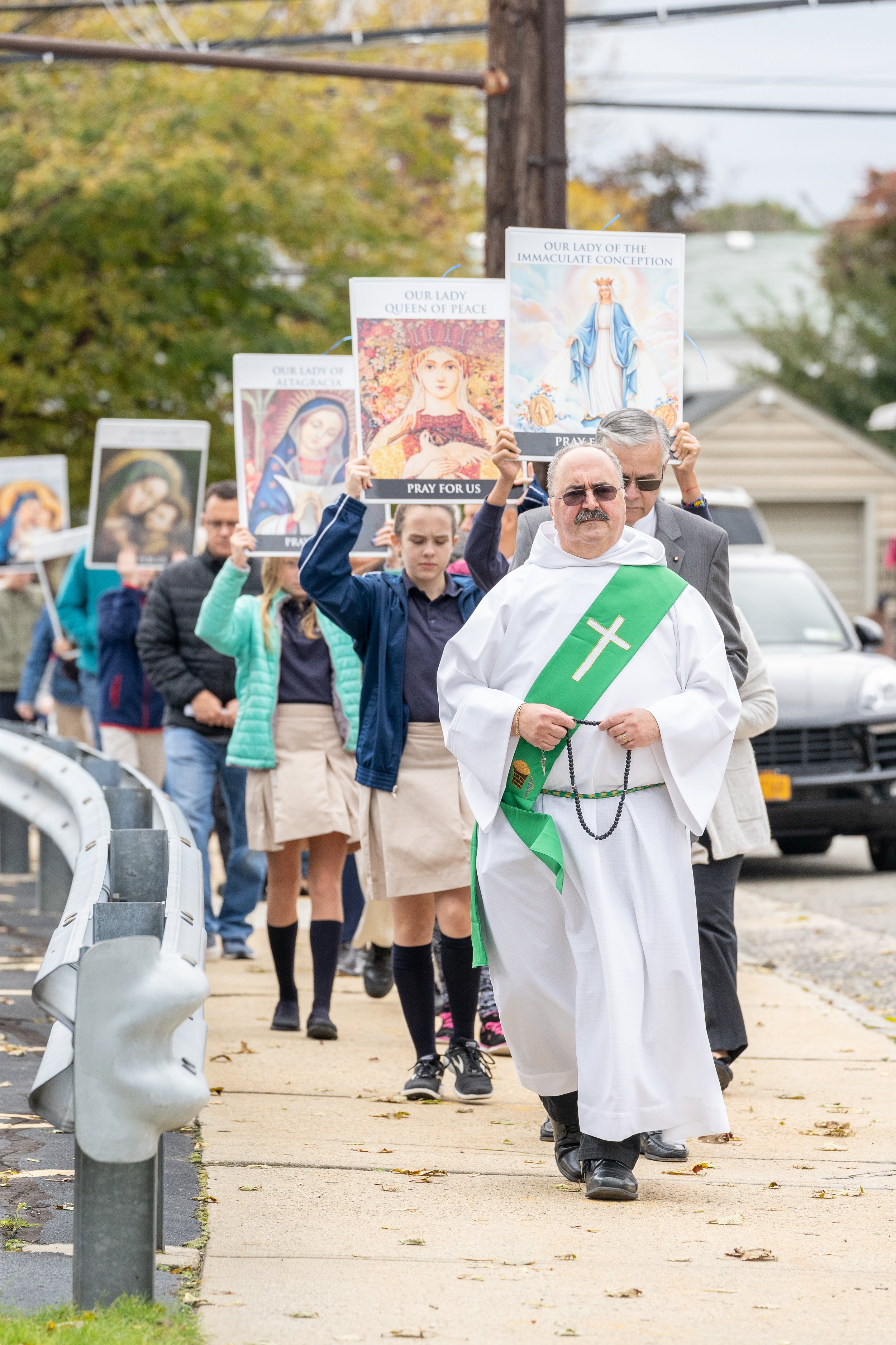 Dcn. Tom Lemme leads a rosary procession at Notre Dame Church in New Hyde Park, NY.
