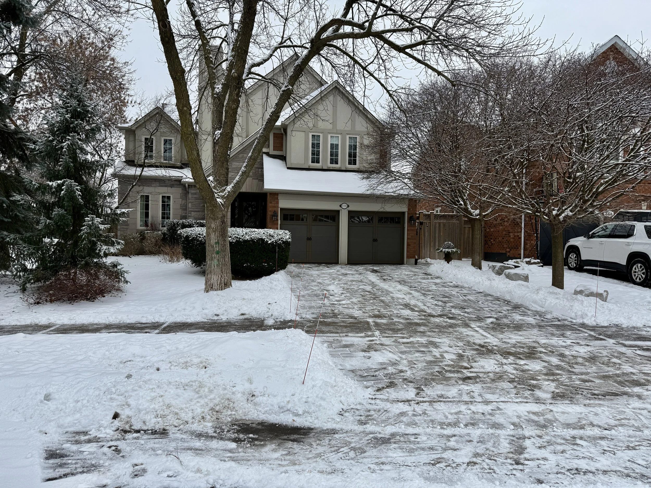 Driveway snow removal service at a Glen Abbey Oakville home