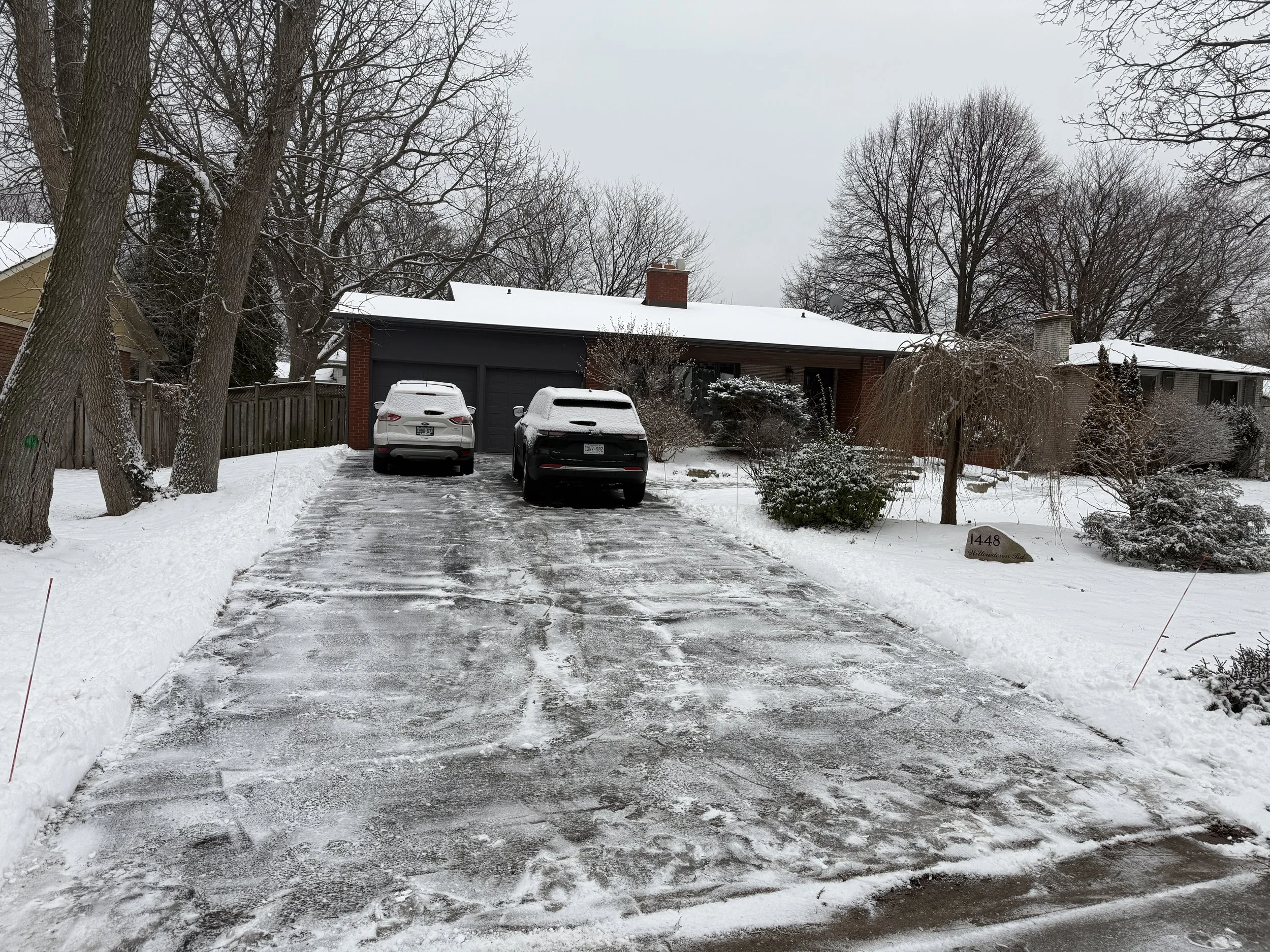 Clean residential driveway in Oakville after professional snow removal