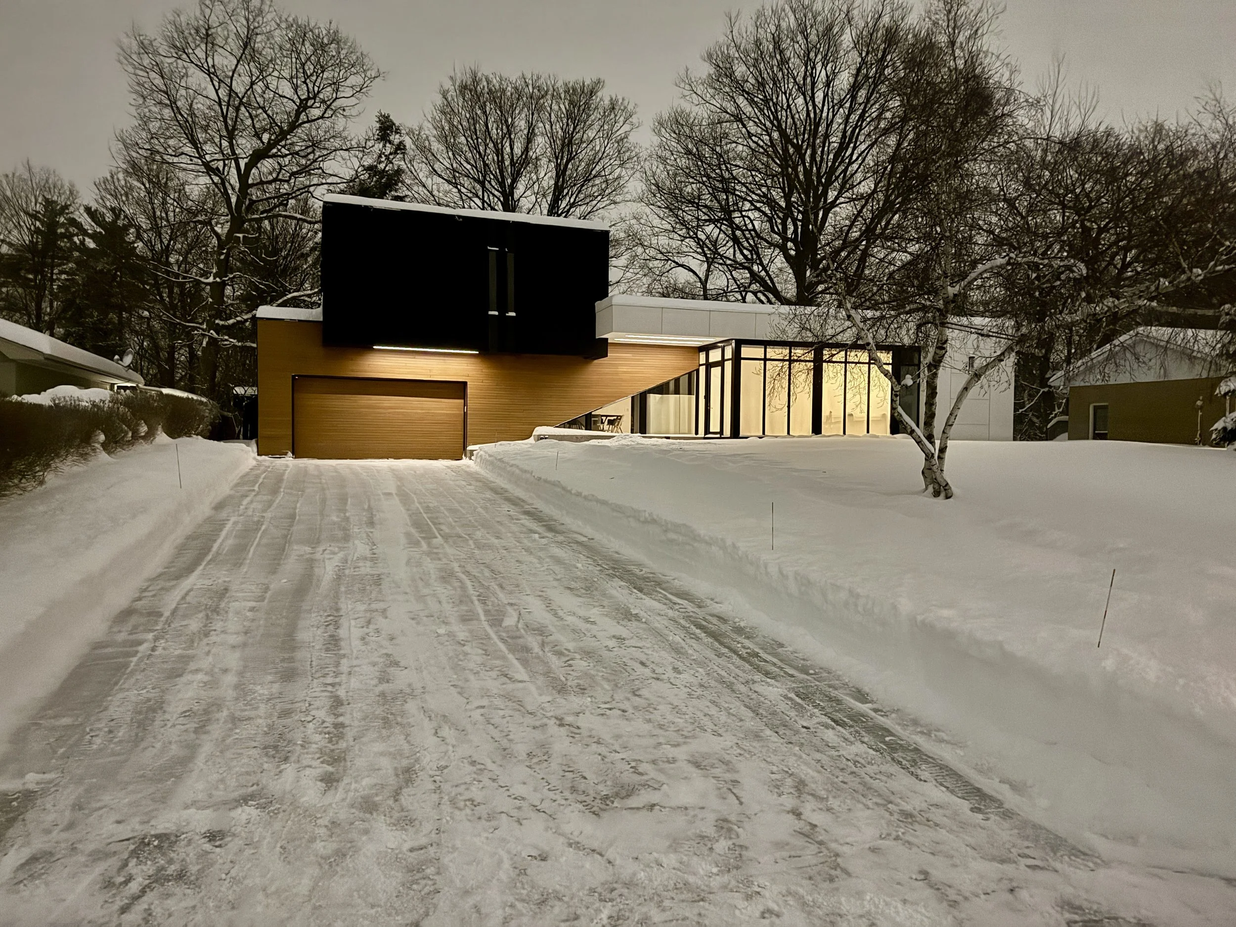 Residential snow removal in Oakville clearing a homeowner driveway after snowfall