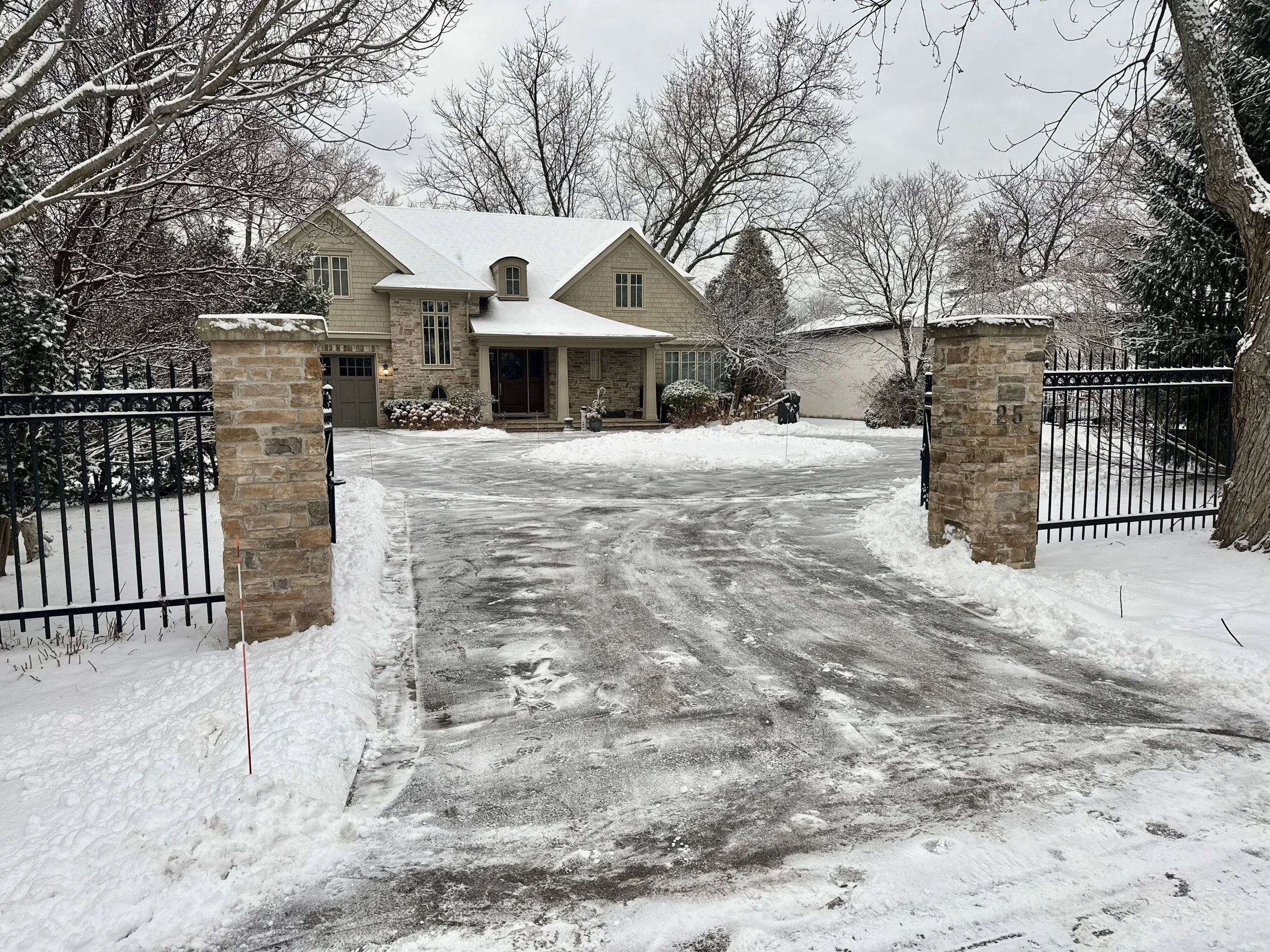 Snow removal service in Bronte Oakville clearing residential driveway
