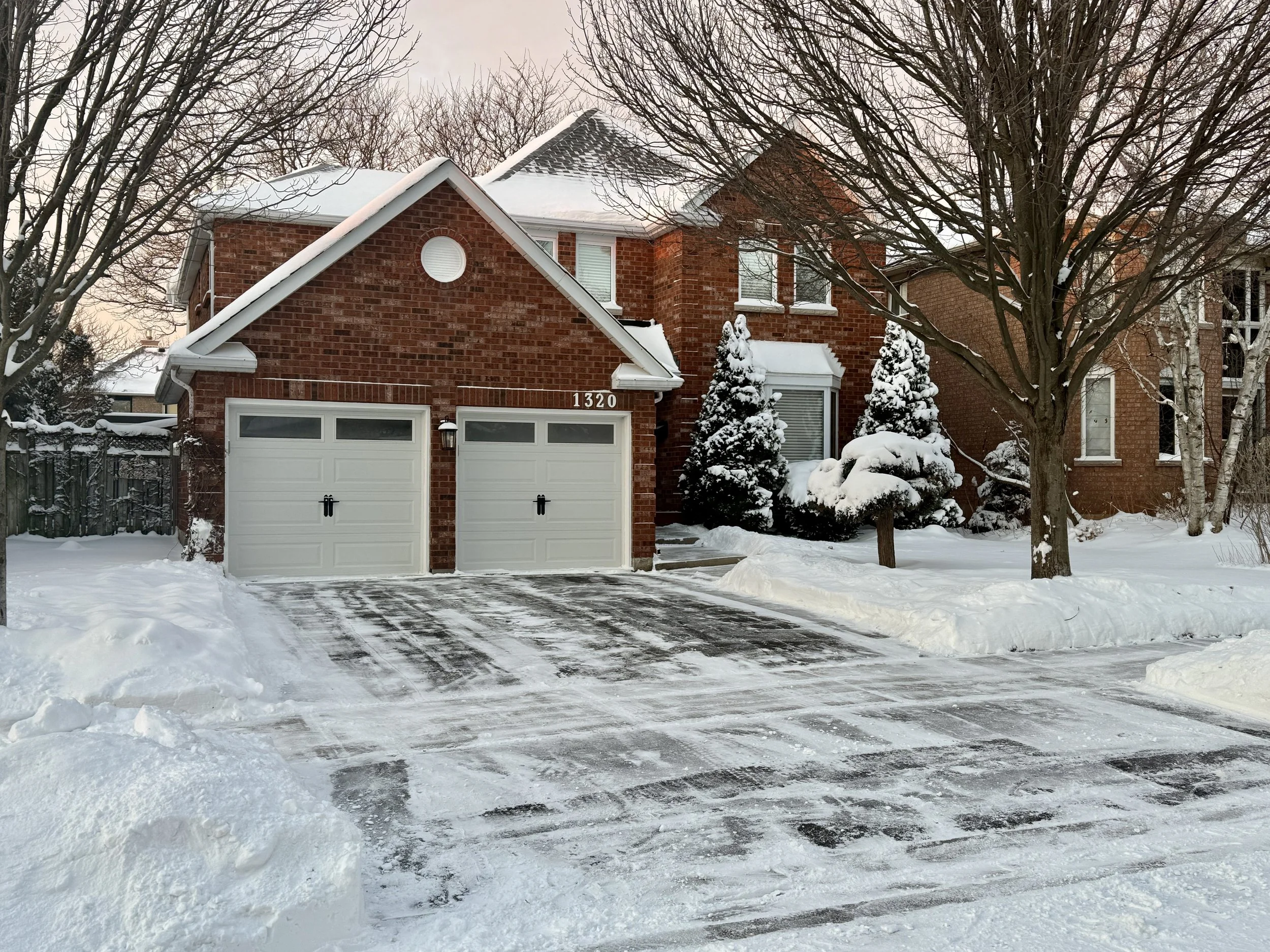 Driveway cleared in the Glen Abbey area in Oakville, Ontario. Driveway cleared using blowers and shovels.