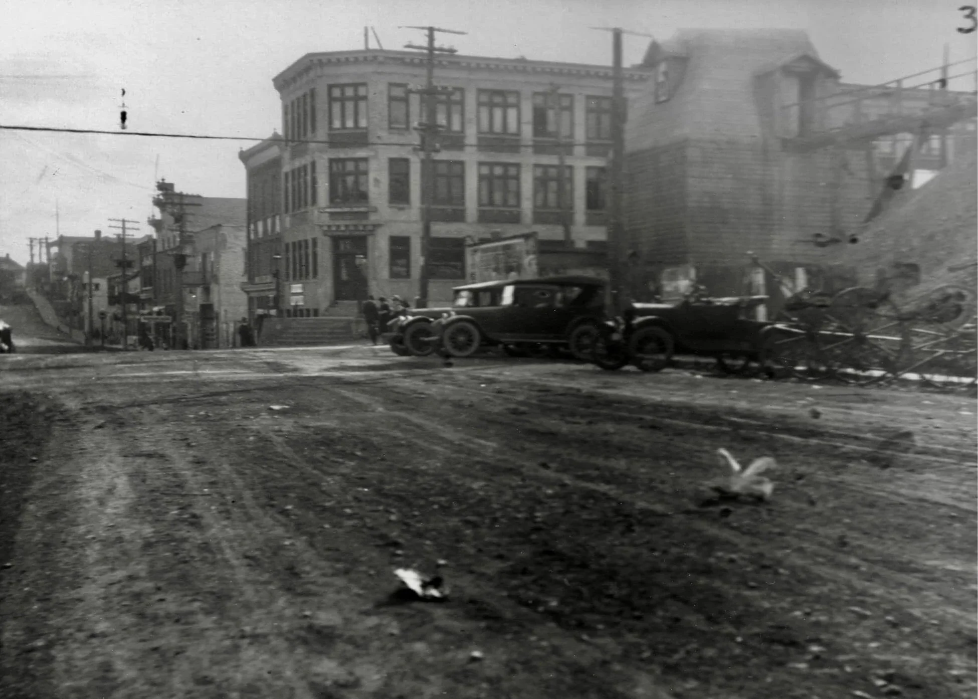 An early photo looking down Silver St. The Coniagas Shaft House #4 sits on the right with its trestle extending out.
