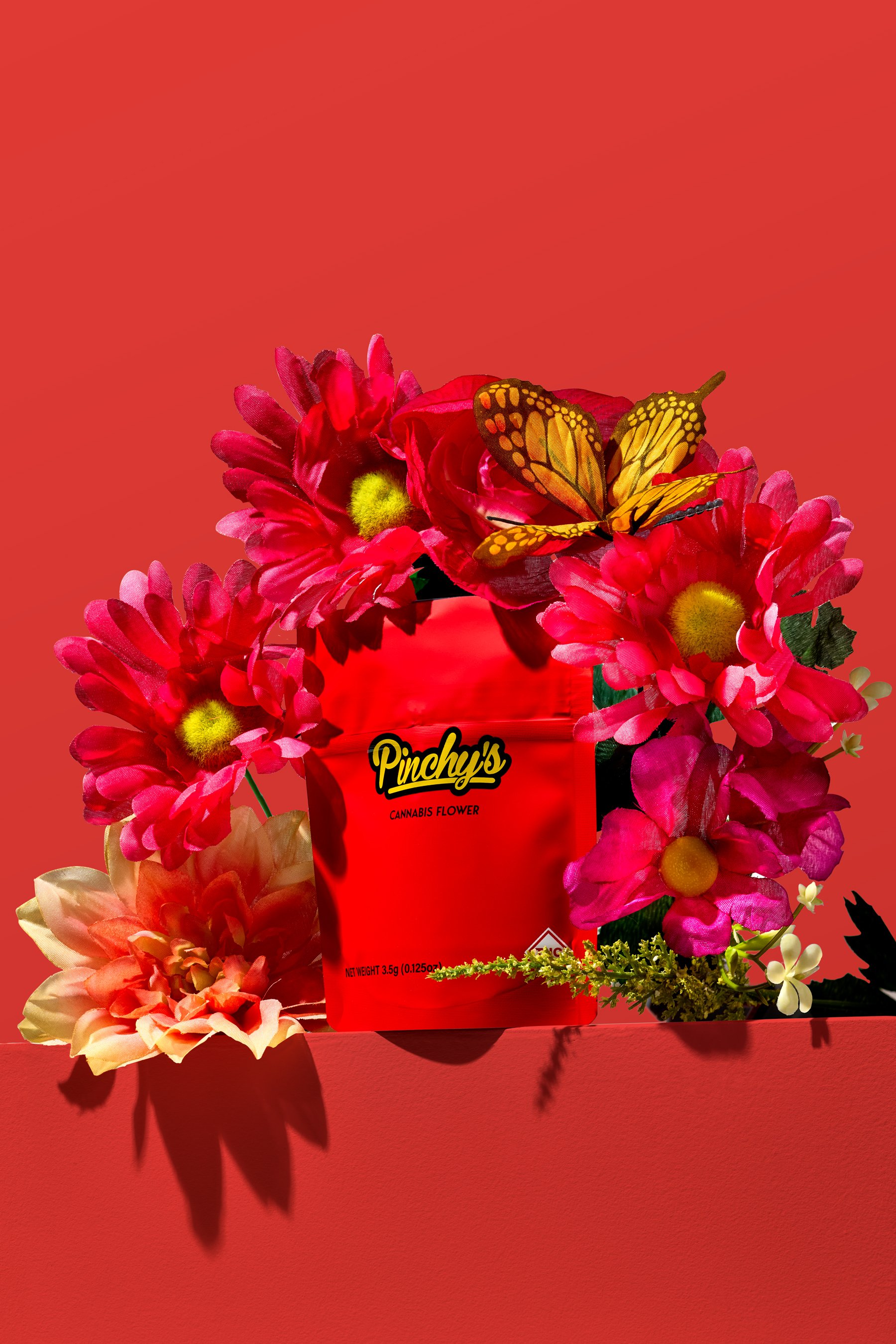 Pinchys-Flower-Hero-w-Red-BG.jpg