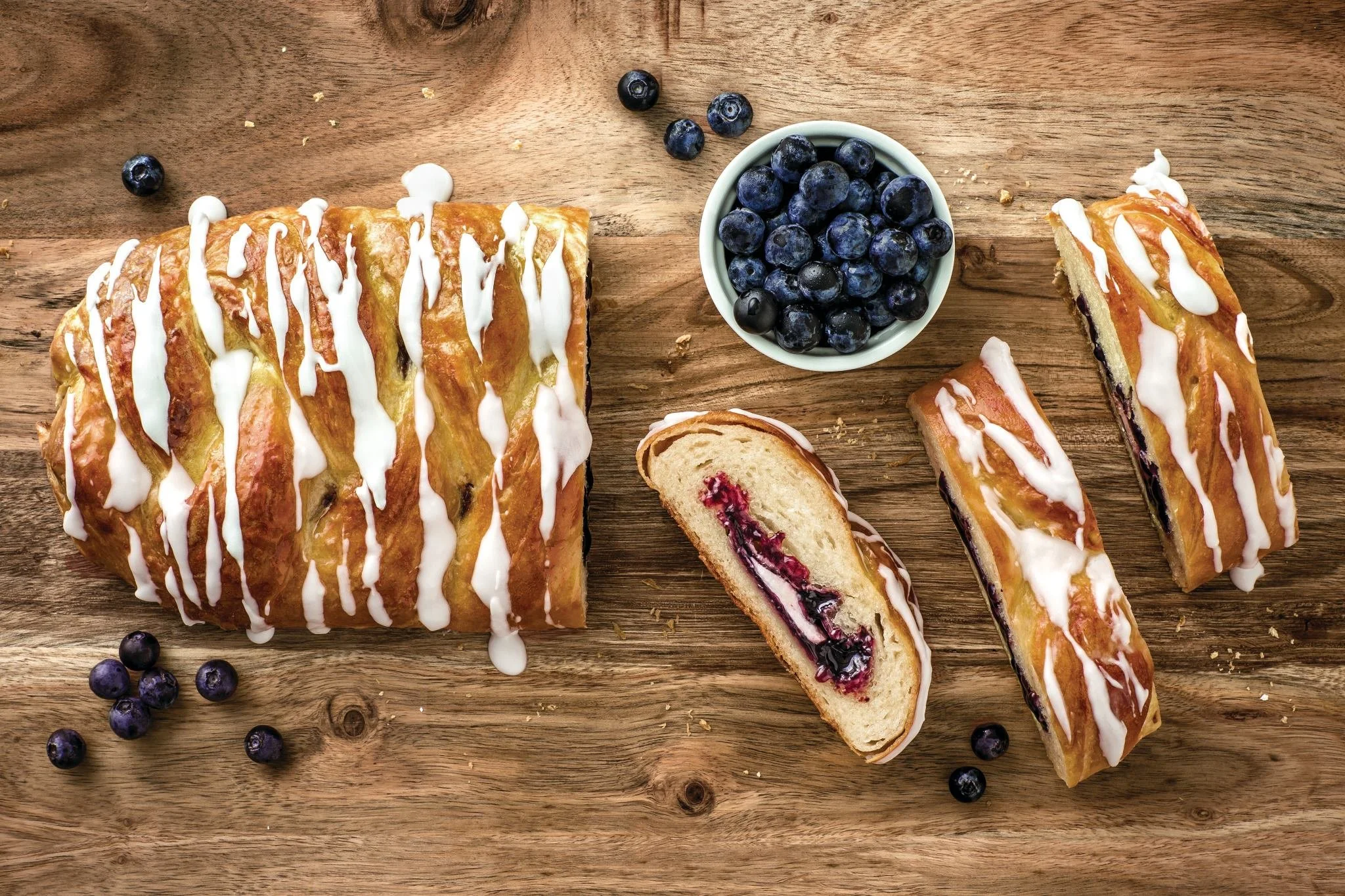 Blueberry and Cream Cheese Butter Braid Pastry with a bowl of blueberries