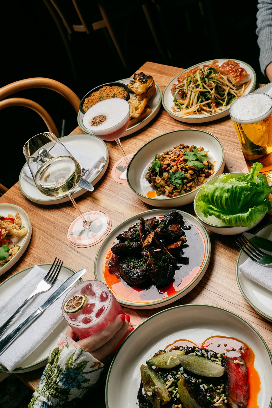 Shared Southeast Asian fine dining dishes at Two Noble, including gluten free and dietary-friendly options