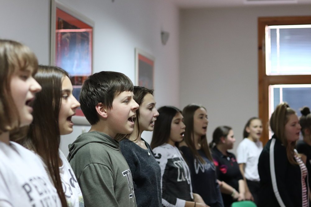 A youth choir singing during a TAI fellowship