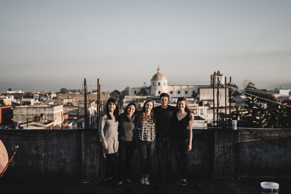 Fellows singing at dusk overlooking the city