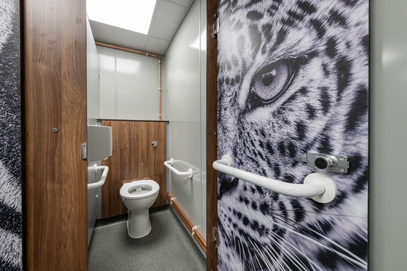 an ambulent cubicle with half height duct panel and image printed door at banham zoo.jpg