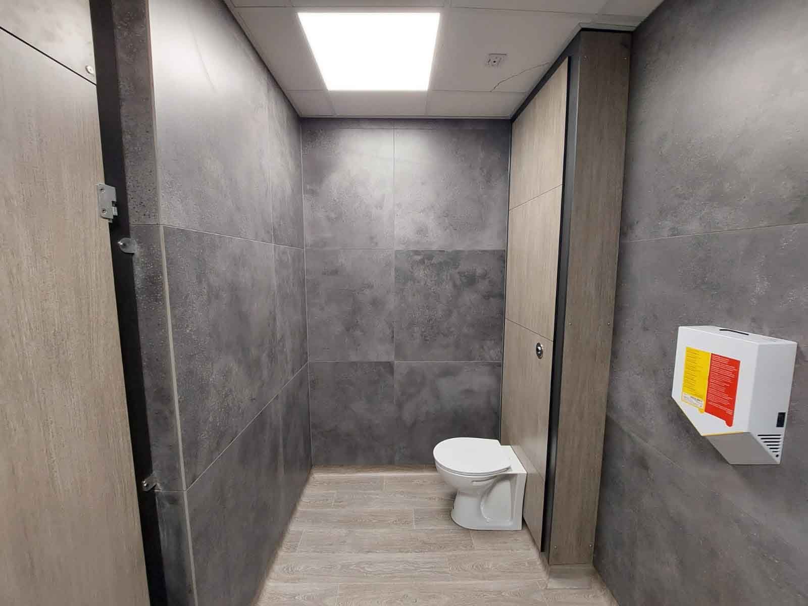  toilet in a washroom cubicle 