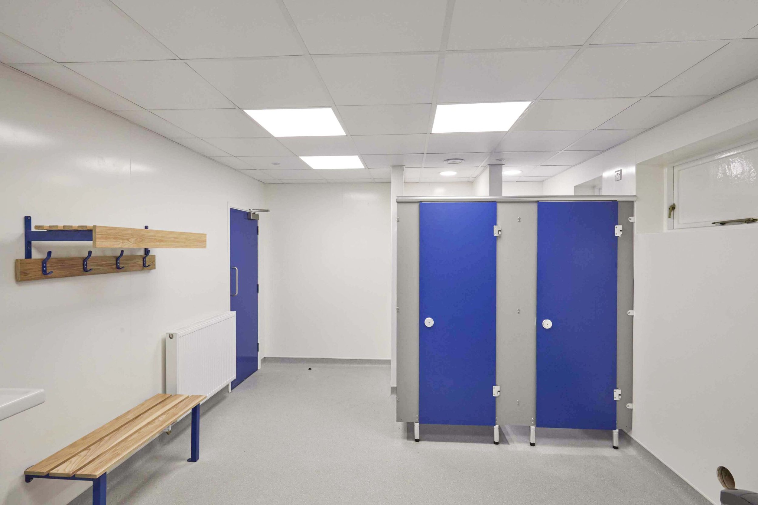  shower cubicles and benching in a changing room refurbishment at secondary school 