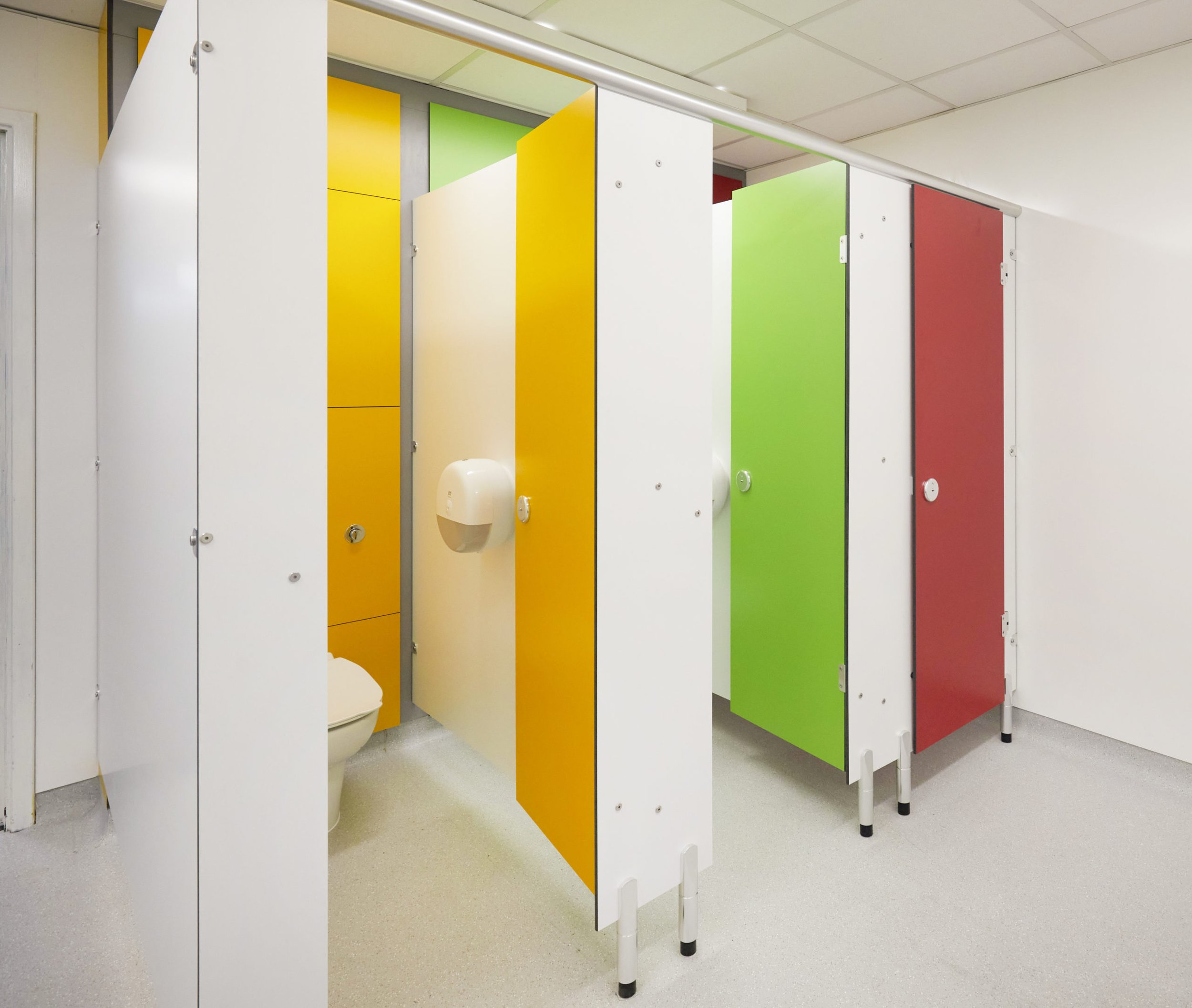 row of cubicles with multicoloured ducting and doors at upland school.jpg