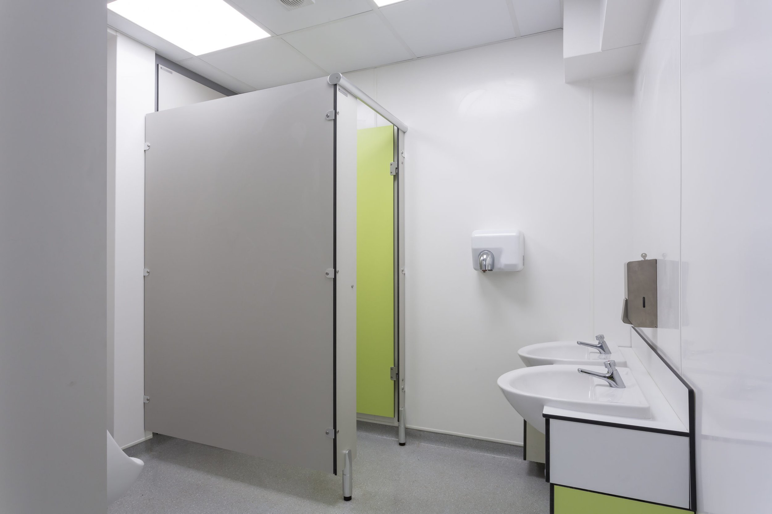 toilet cubicle and vanity unit in green and grey colours at cliff park school.jpg