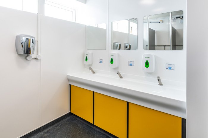 vanity unit hand wash area with trough top and touch-free taps at southwold pier toilets.jpg