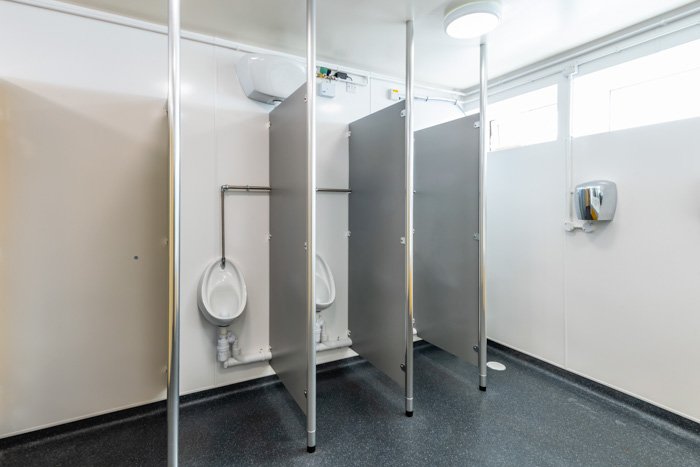 urinals with grey partitions at southwold pier public toilets.jpg