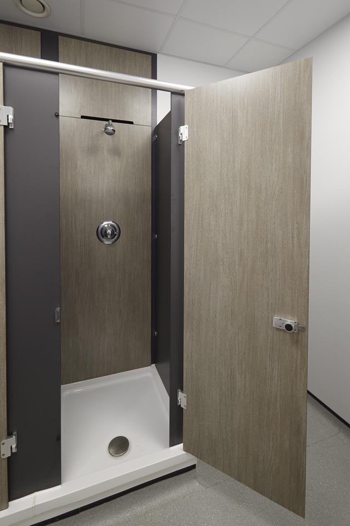 Shower cubicle with a shower tray in a woodgrain colour at leicester college.jpg
