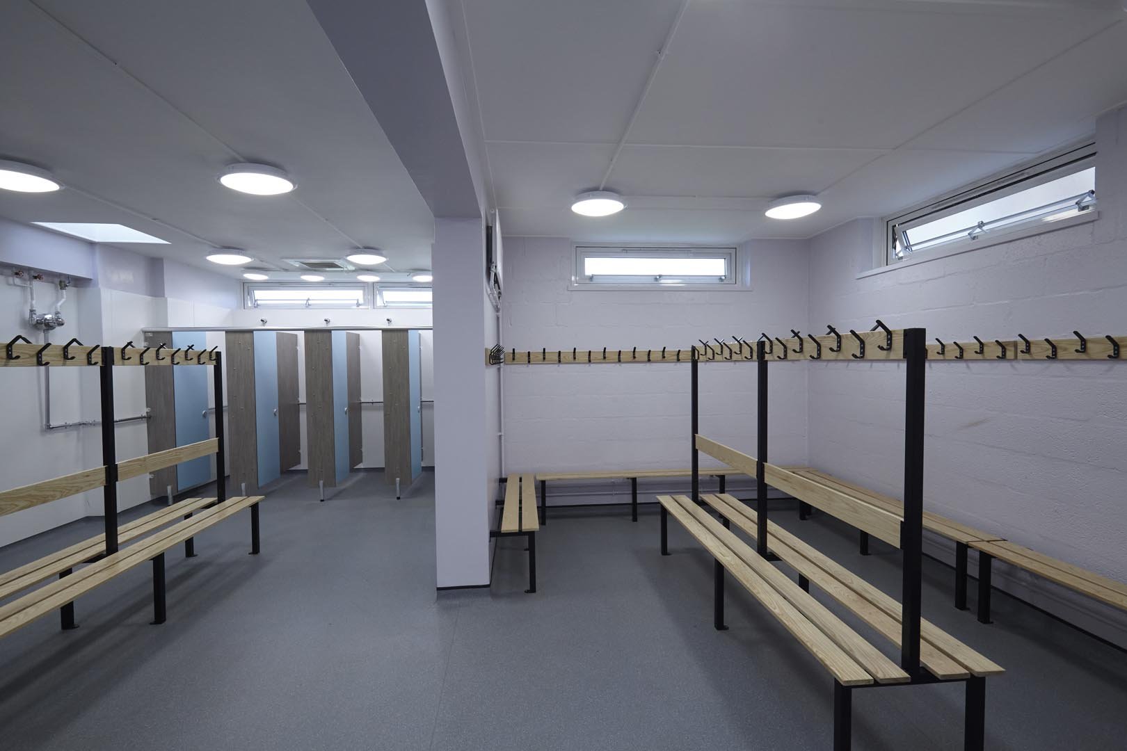large changing room with benching and showers at churchmead school.jpg
