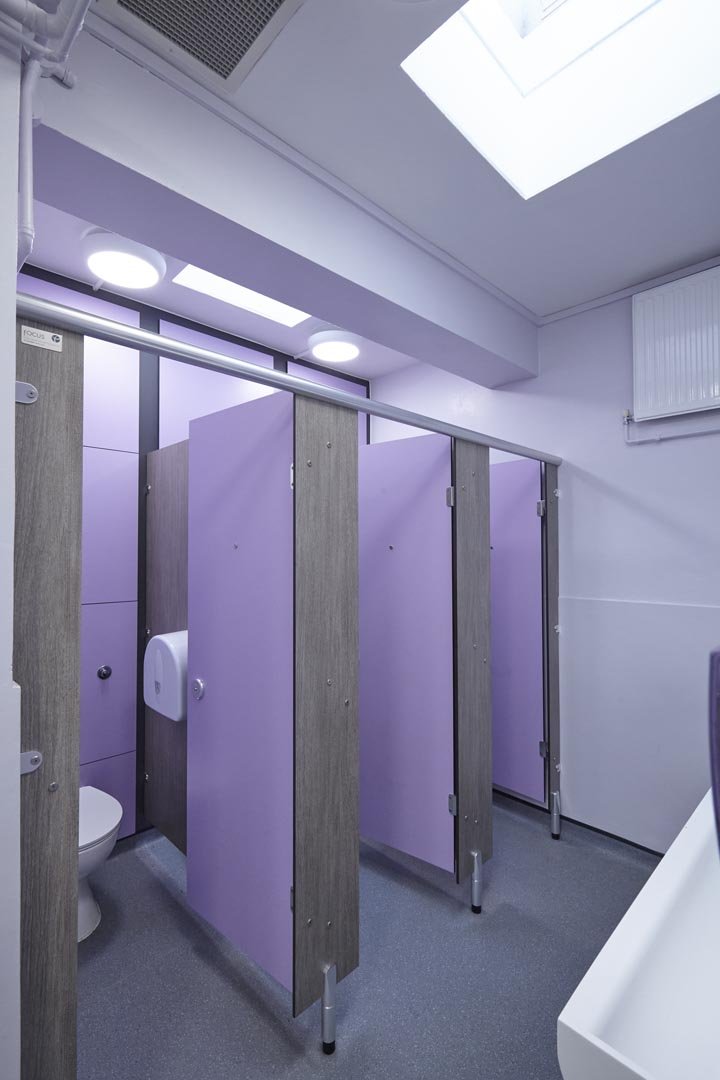 purple and grey toilet cubicles with full height duct panels at churchmead school.jpg