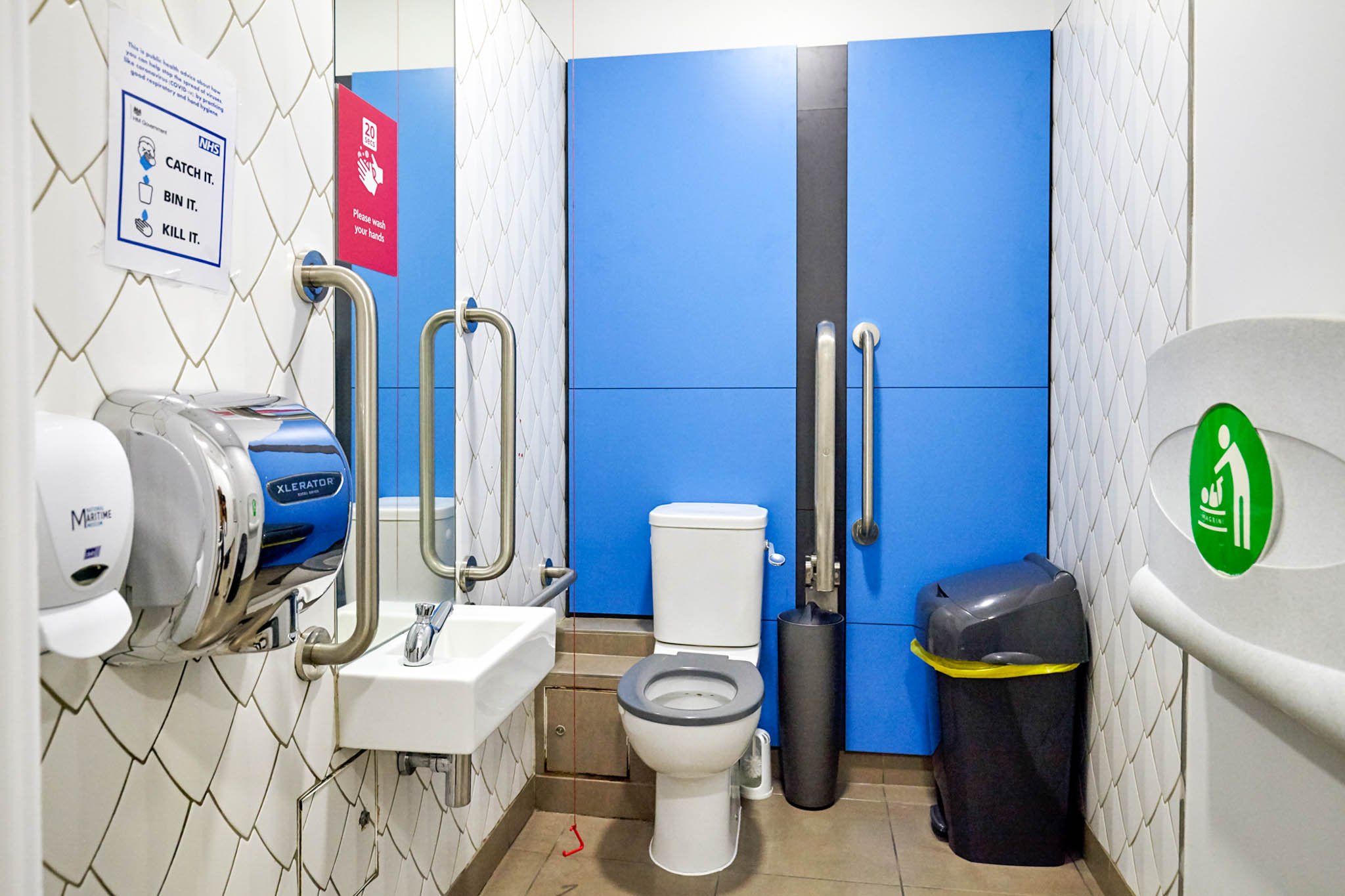 Disabled doc m toilet and baby changing unit with feature tiling at national maritime museum.jpg