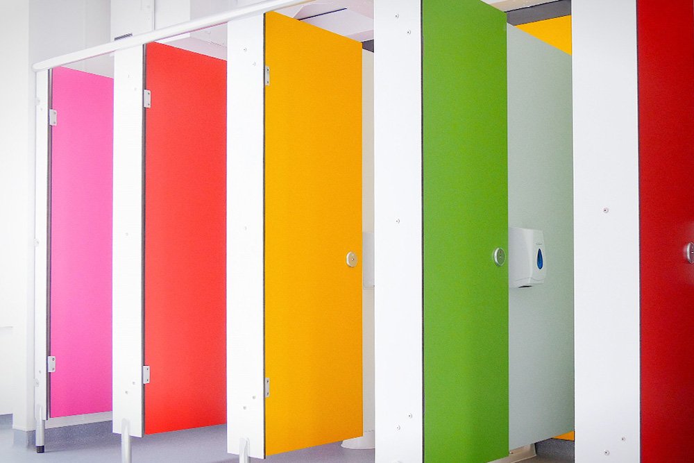 multicoloured toilet cubicle doors at lycee francais.jpg