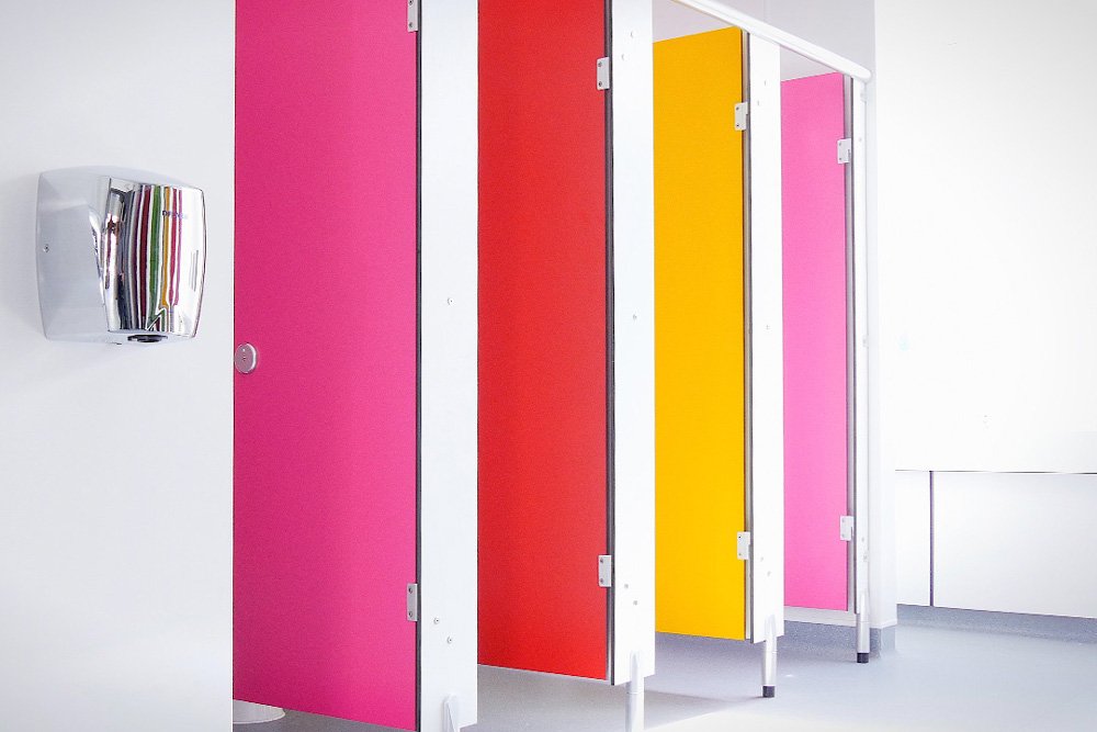 row of multicoloured cubciles and a hand dryer at lycee francais.jpg