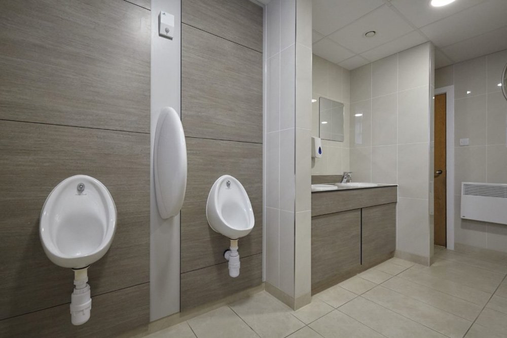 full height woodgrain ducts with urinals and a woodgrain vanity unit at lenta business centre.jpg