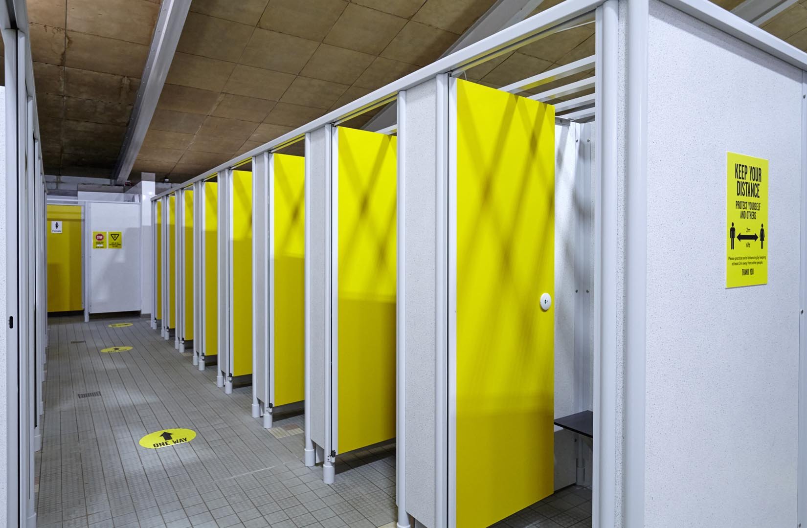 row of durable yellow poolside changing cubicles at faringdon leisure centre.jpg