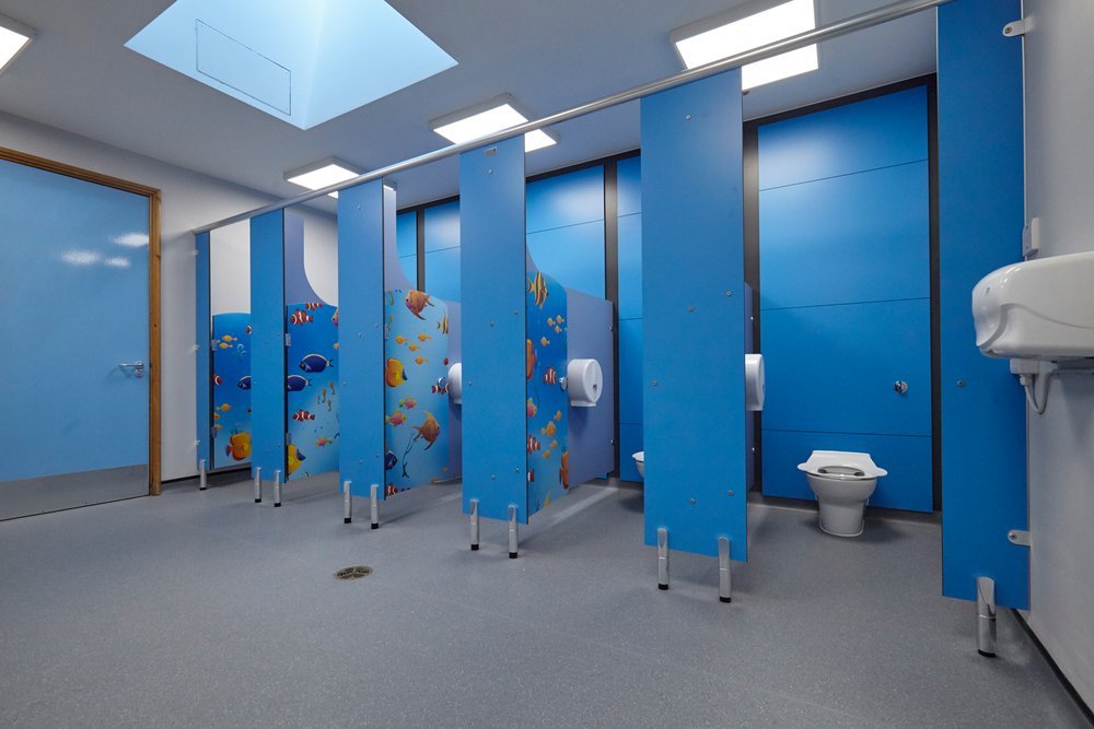  child cubicles in a school washrooms with a under the sea theme 