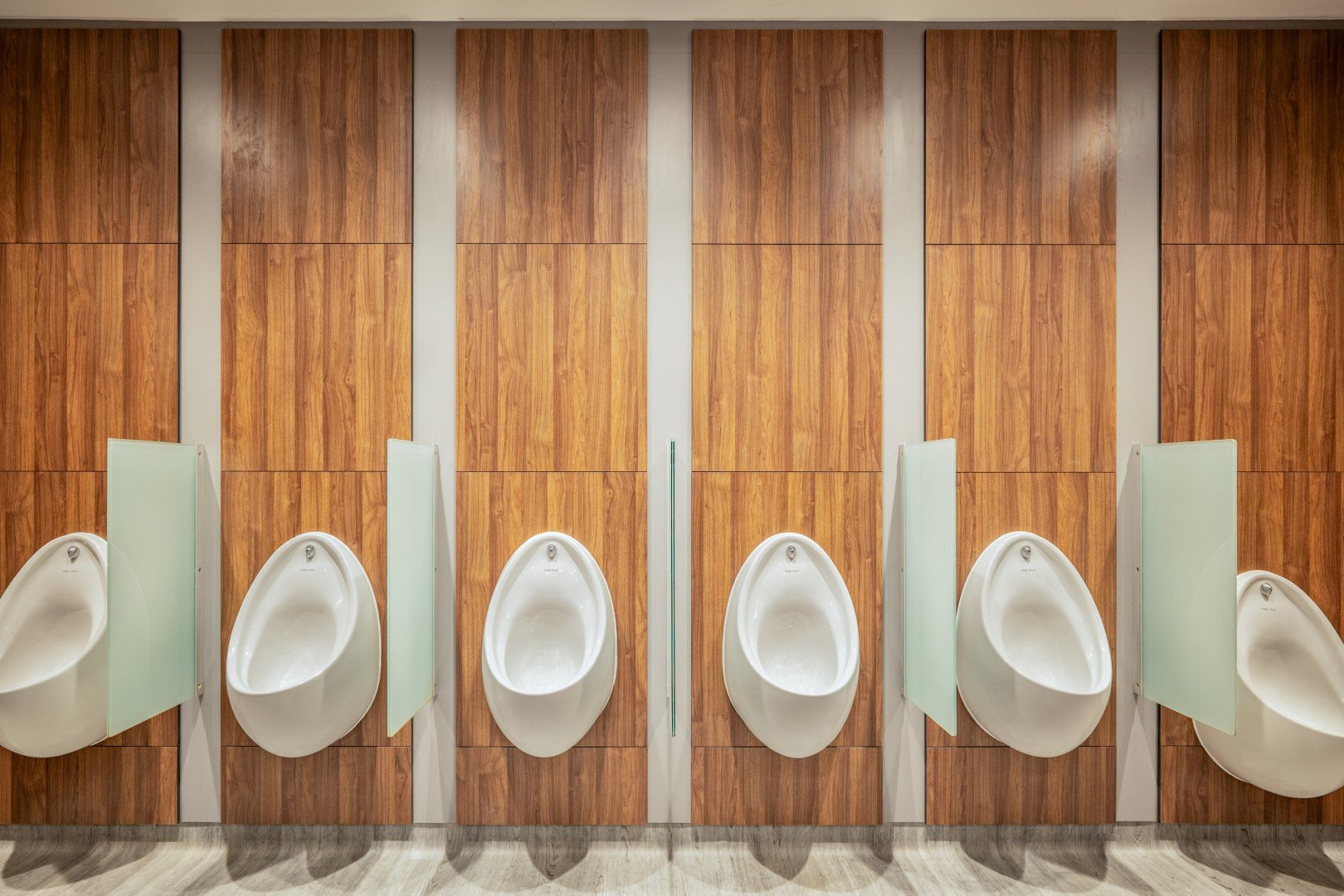  urinals in a washroom 