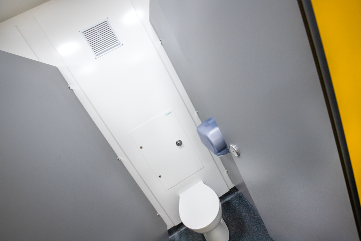 a toilet cubicle with white hygipod ips at blyburgate public toilets.png