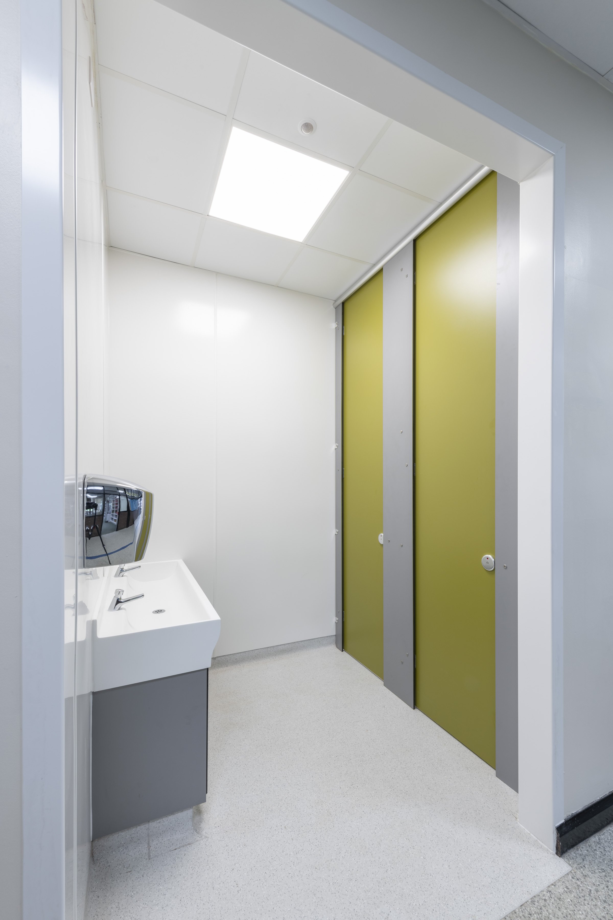 unisex washroom at stoke high with privacy cubicles in green.jpg